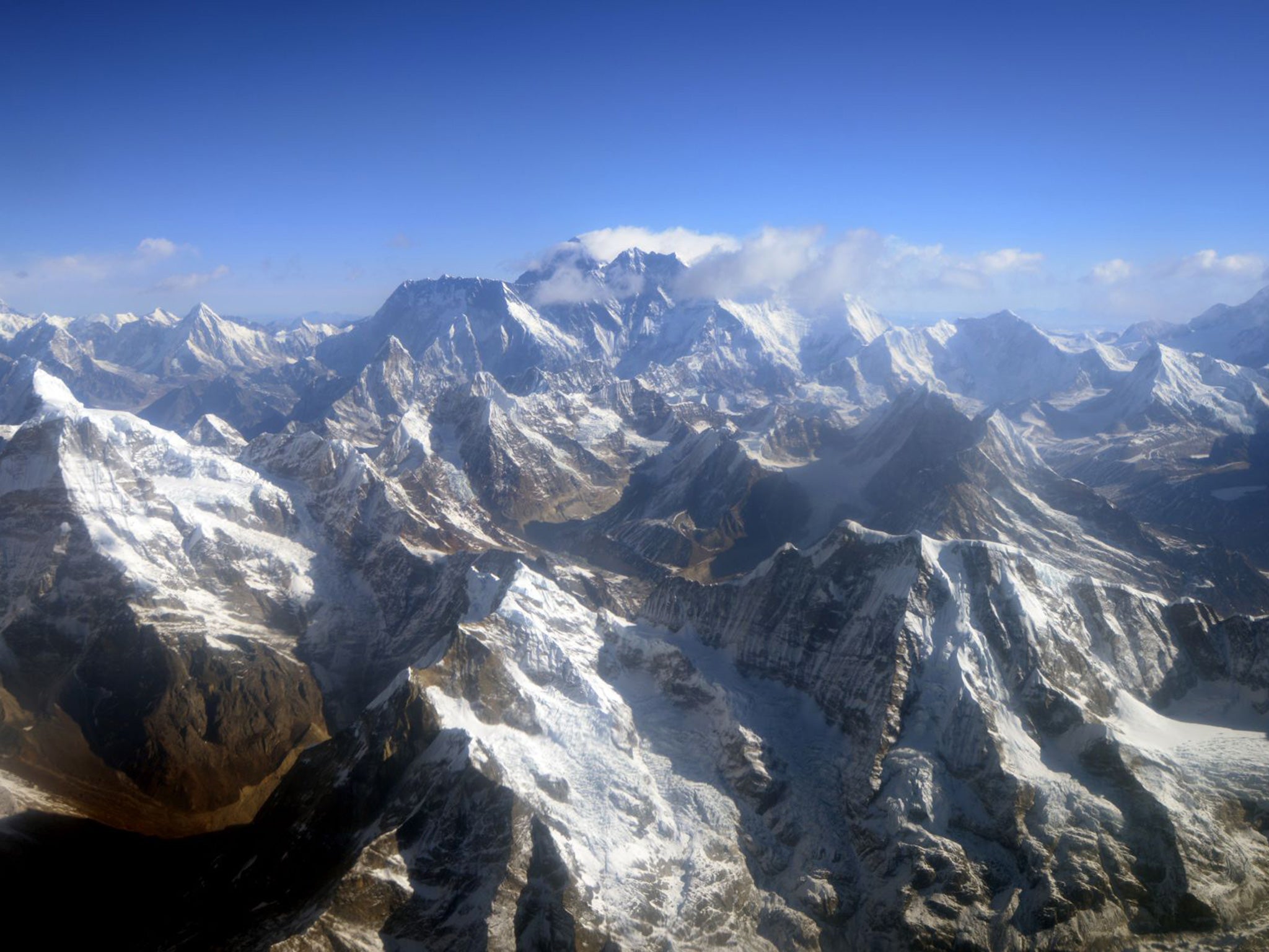 An aerial view of Mount Everest (C). Two-thirds of accidents and injuries come on the way back from the summit