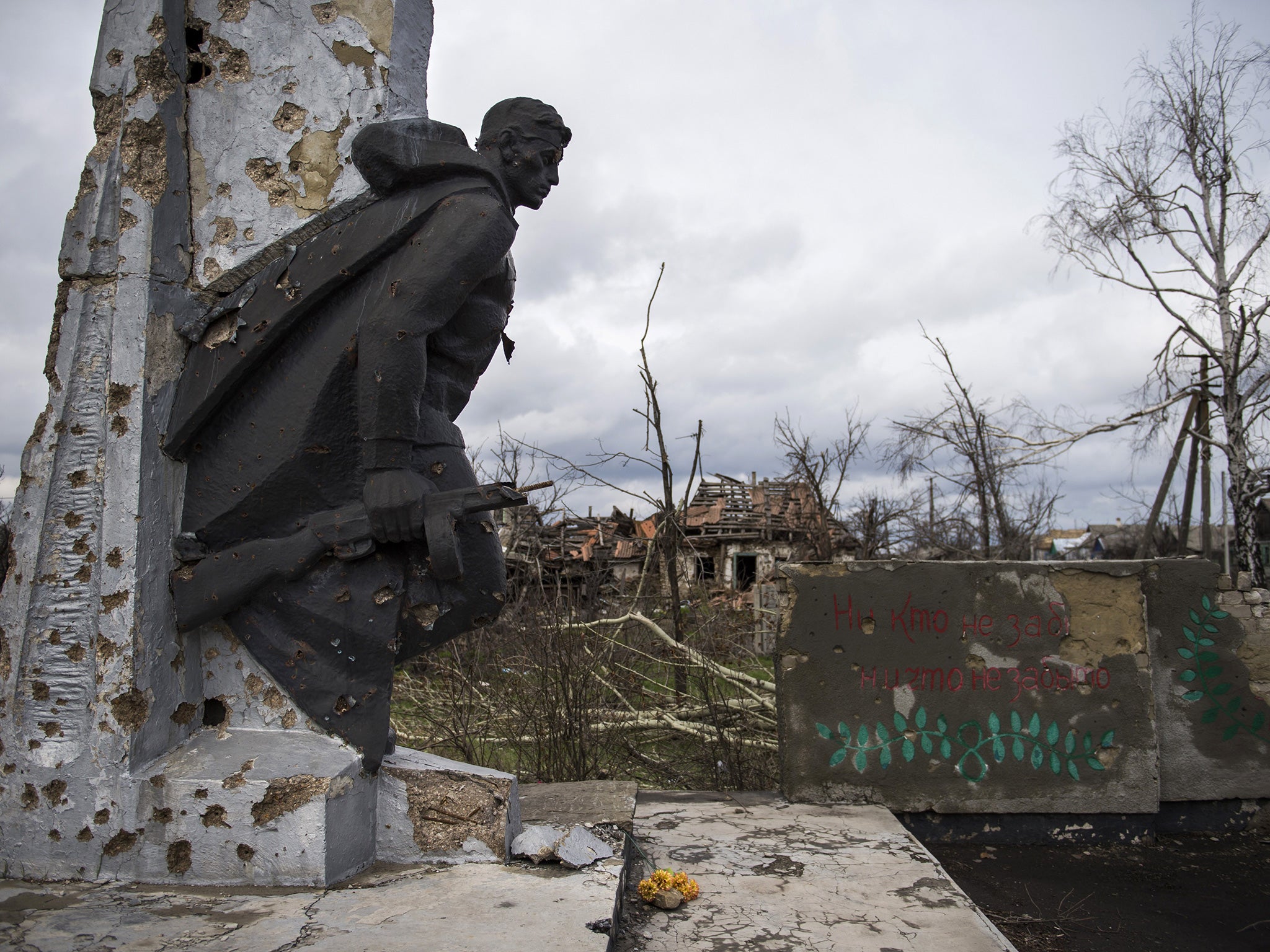 A war damaged WWII memorial is seen in the village of Nikishino on April 21, 2015 in the self-proclaimed Donetsk People's Republic (DNR)