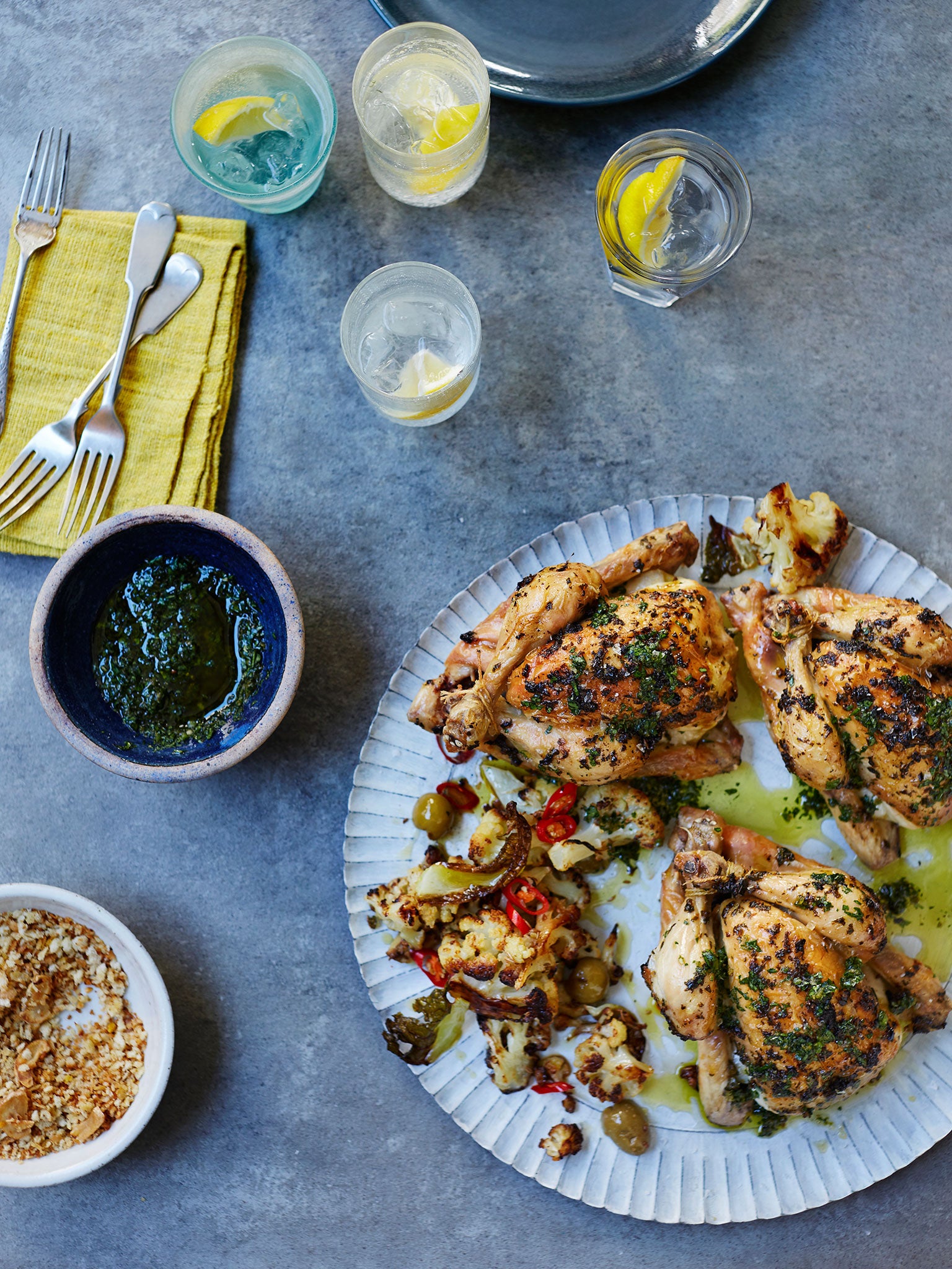 Harissa-roasted poussins with cauliflower, olives and crispy breadcrumbs