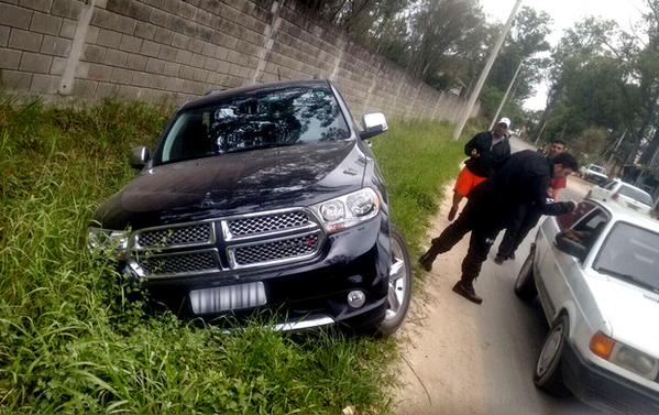 The footballer's 4x4 vehicle wedged in a ditch at the side of a road