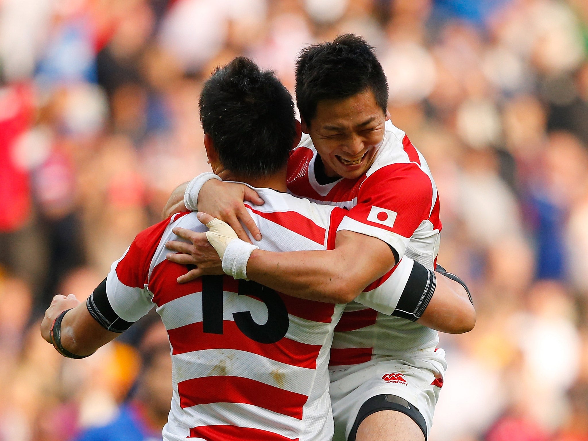 Kosei Ono, right, and Ayumu Goromaru celebrate after the victory over Samoa