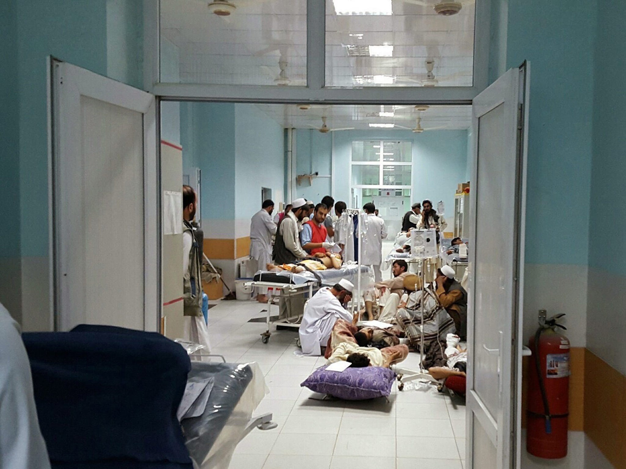 Doctors from Médecins Sans Frontières treat civilians injured in airstrikes against Taliban militants in Kunduz