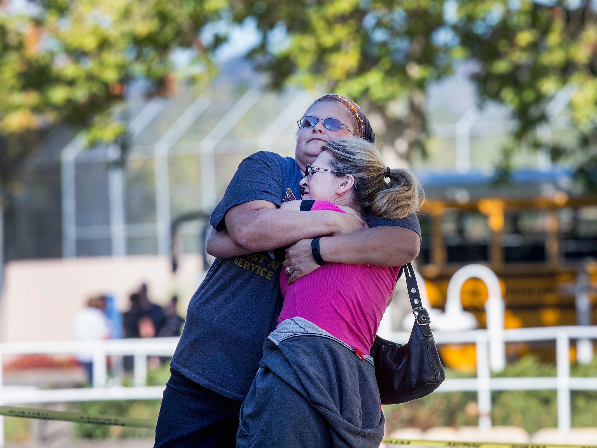 Students console each other following the shootings