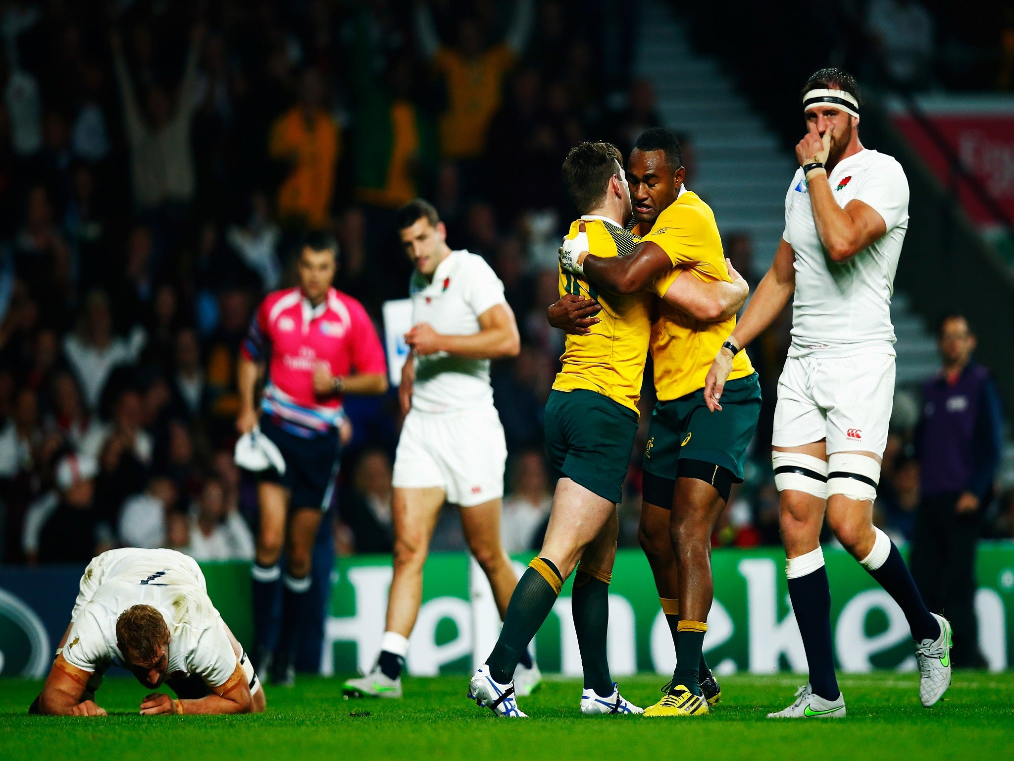 Australia celebrate their second try against England