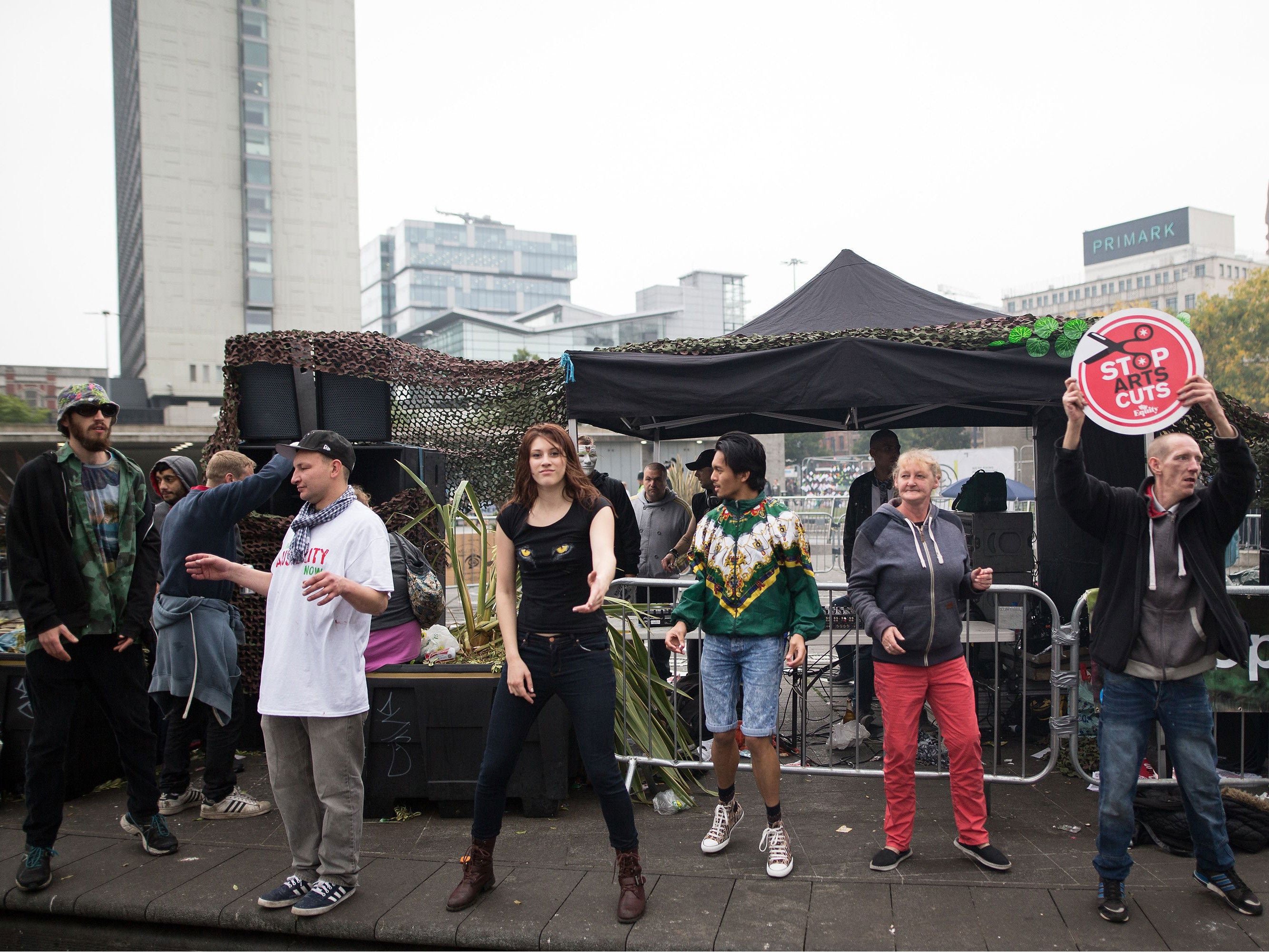 Protesters against the Conservative government's policies hold a non-stop rave in Piccadilly Gardens in Manchester City Centre ahead of the Conservative Party's annual conference .