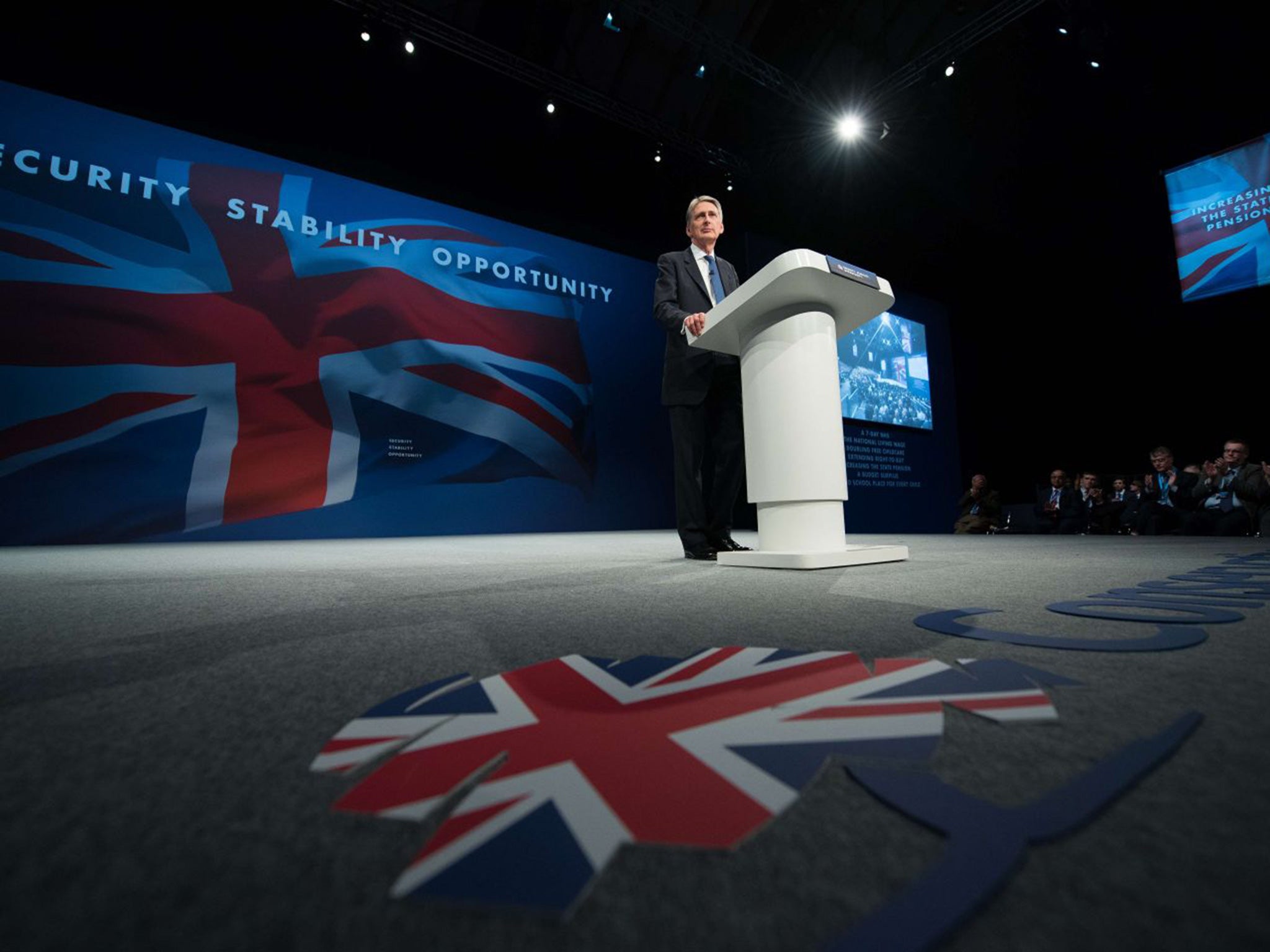 British Foreign Secretary Philip Hammond addresses the conference