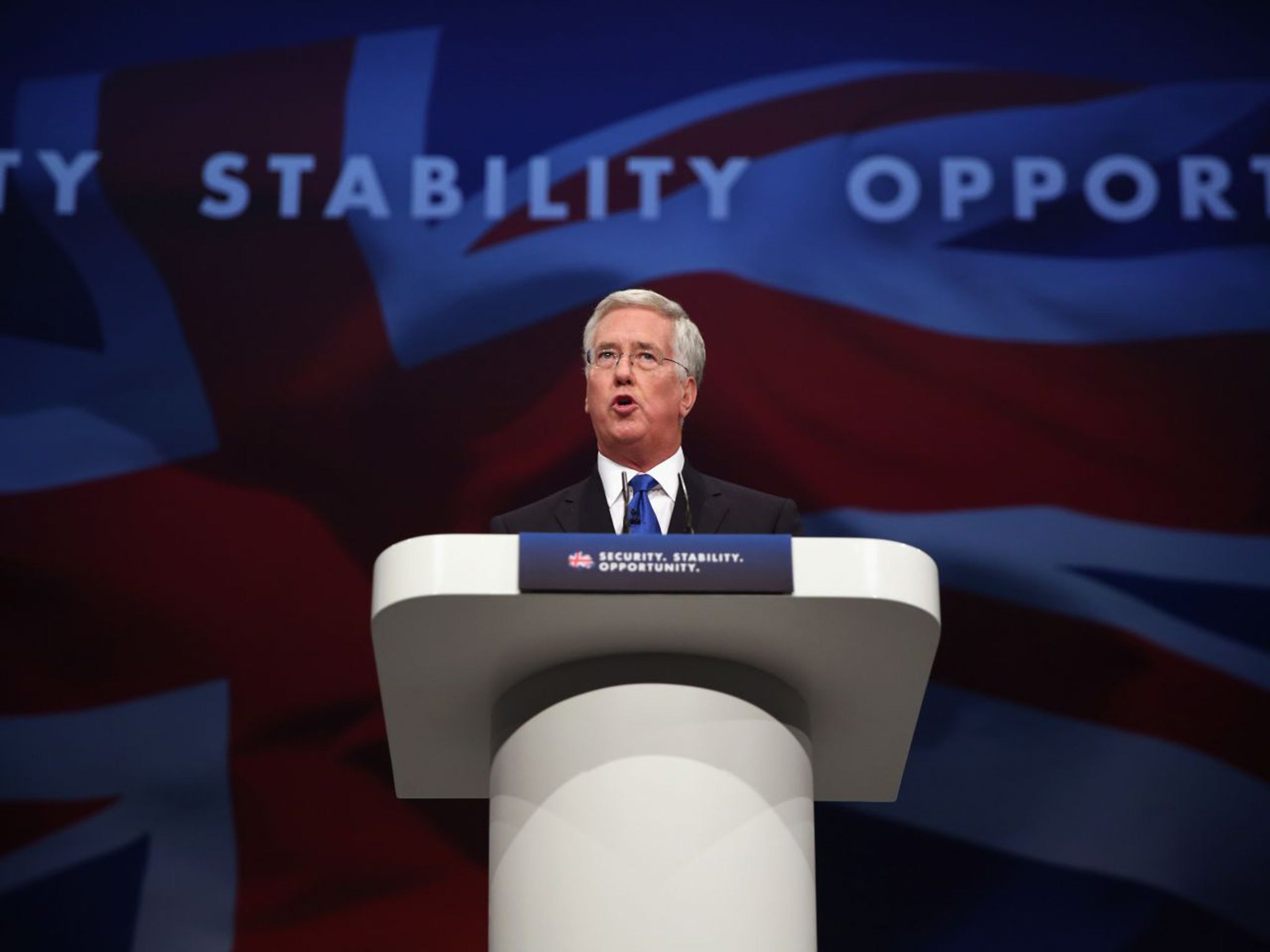 British Defence Secretary Michael Fallon speaks during day one of the Conservative Party Conference on October 4, 2015 in Manchester