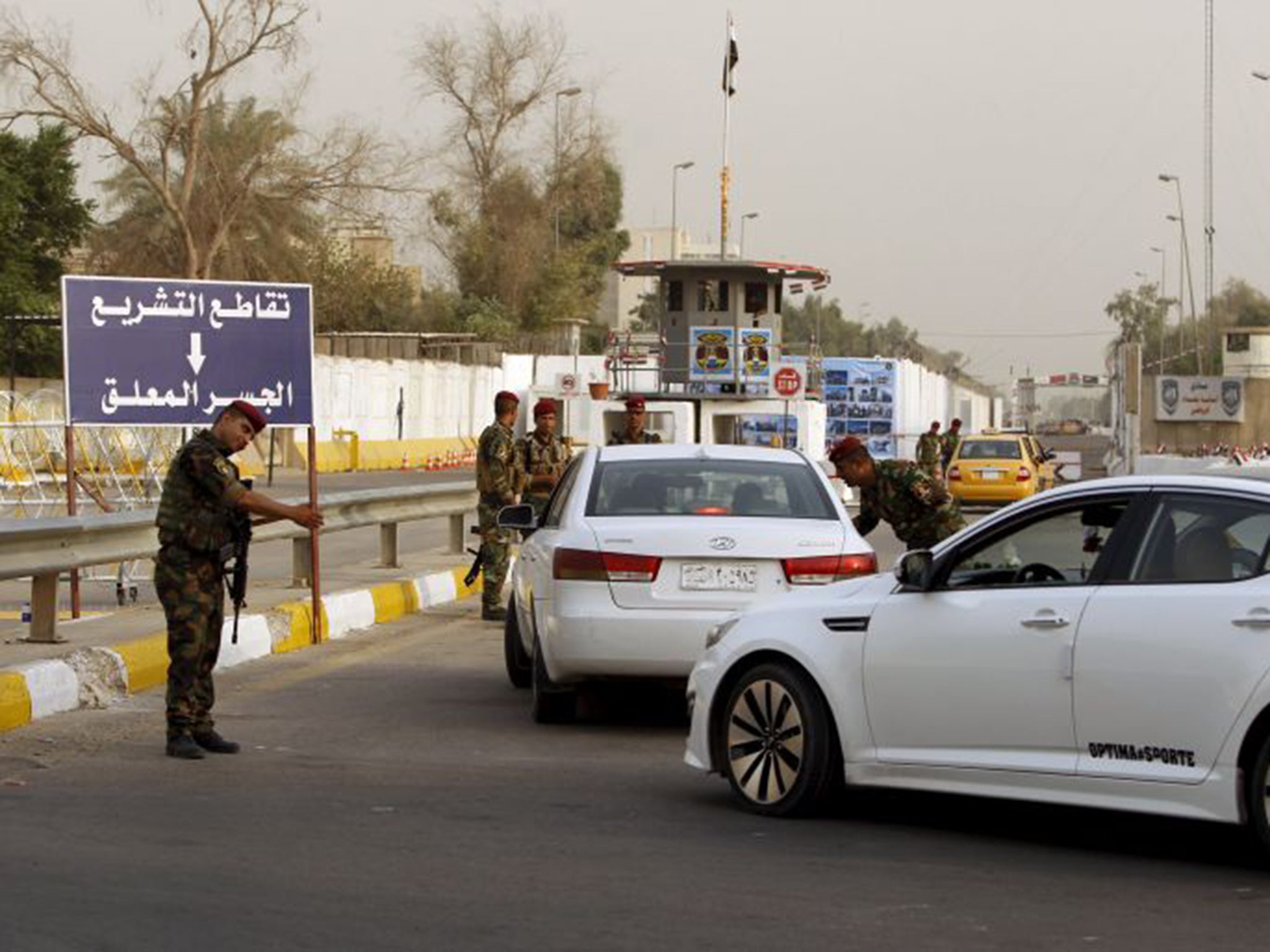 Iraqi security forces guard the Green Zone in Baghdad after it was opened to all citizens on Sunday