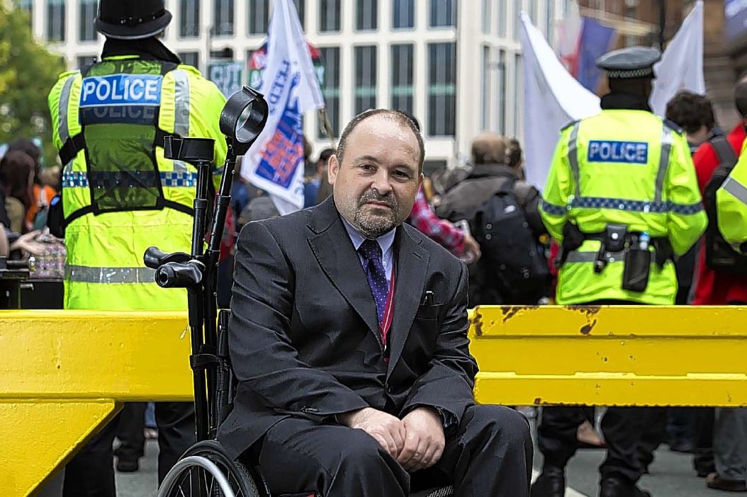 The Independent’s James Moore outside the conference centre in Manchester after he was rounded on by anti-Tory protesters