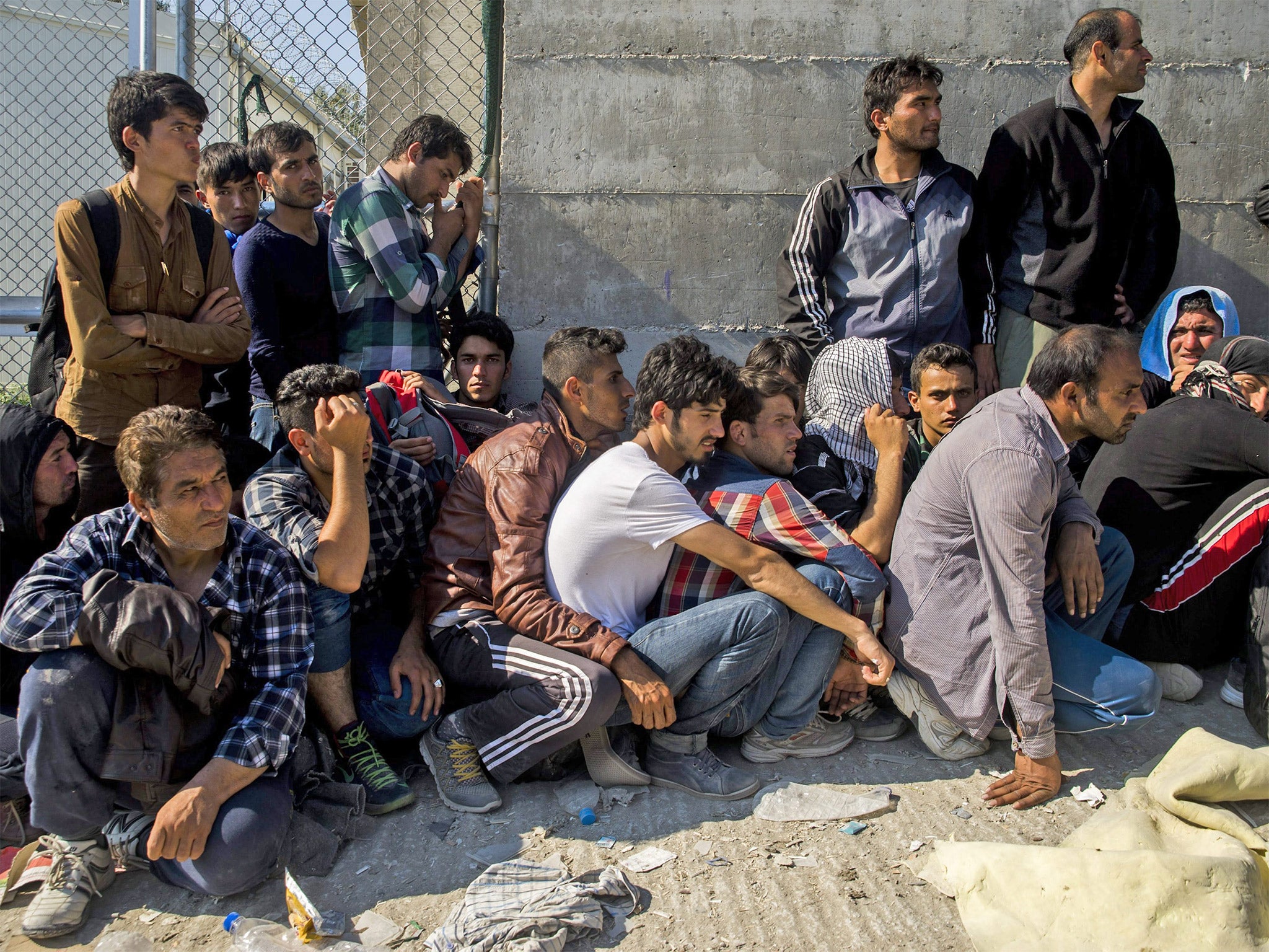 &#13;
Refugees wait to be registered in a camp on the island of Lesbos, Greece &#13;