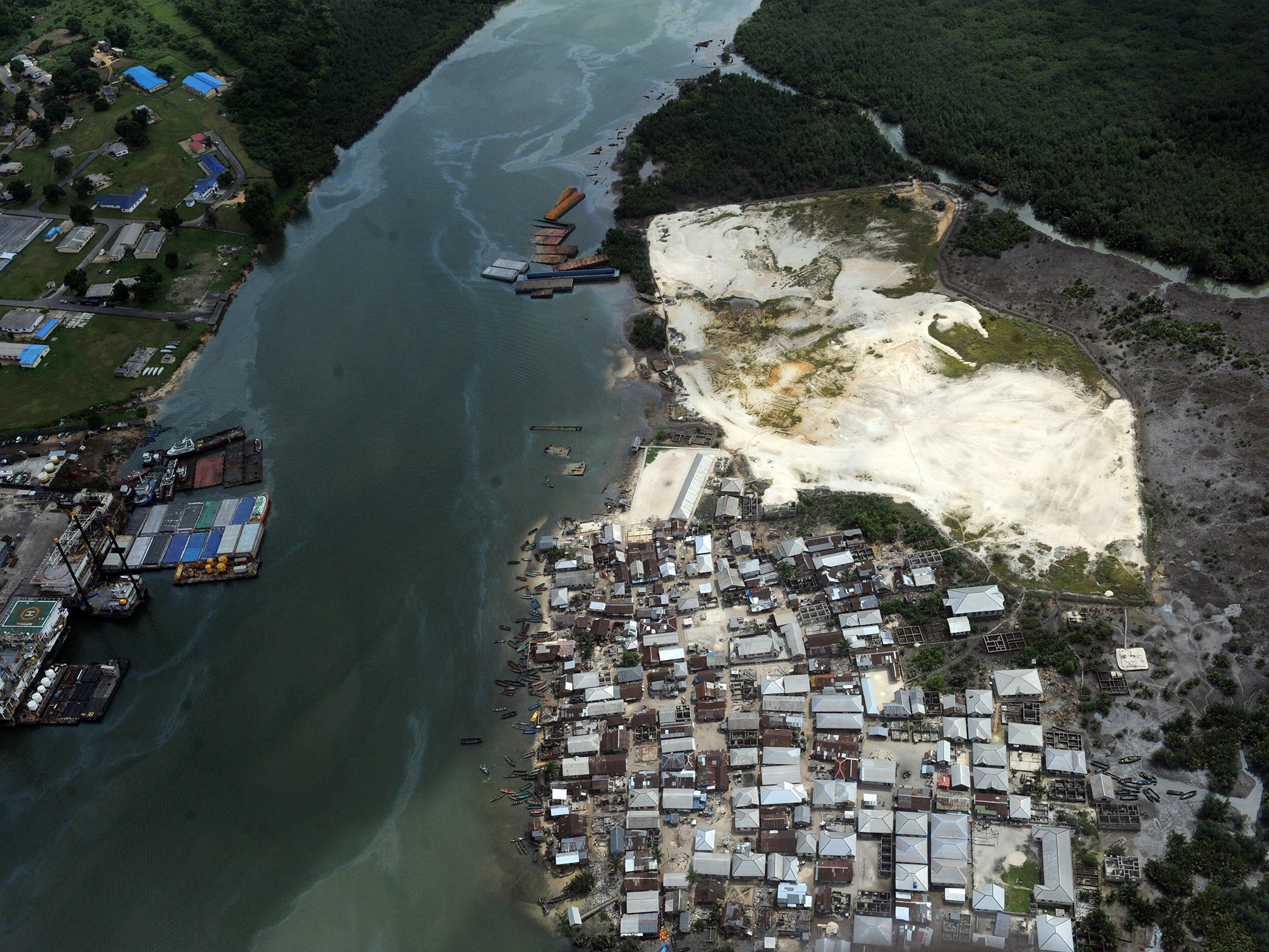 Oil is big business in Nigeria - here reeks and vegetation are devastated as a result of spills from oil thieves and Shell operational failures in Niger Delta