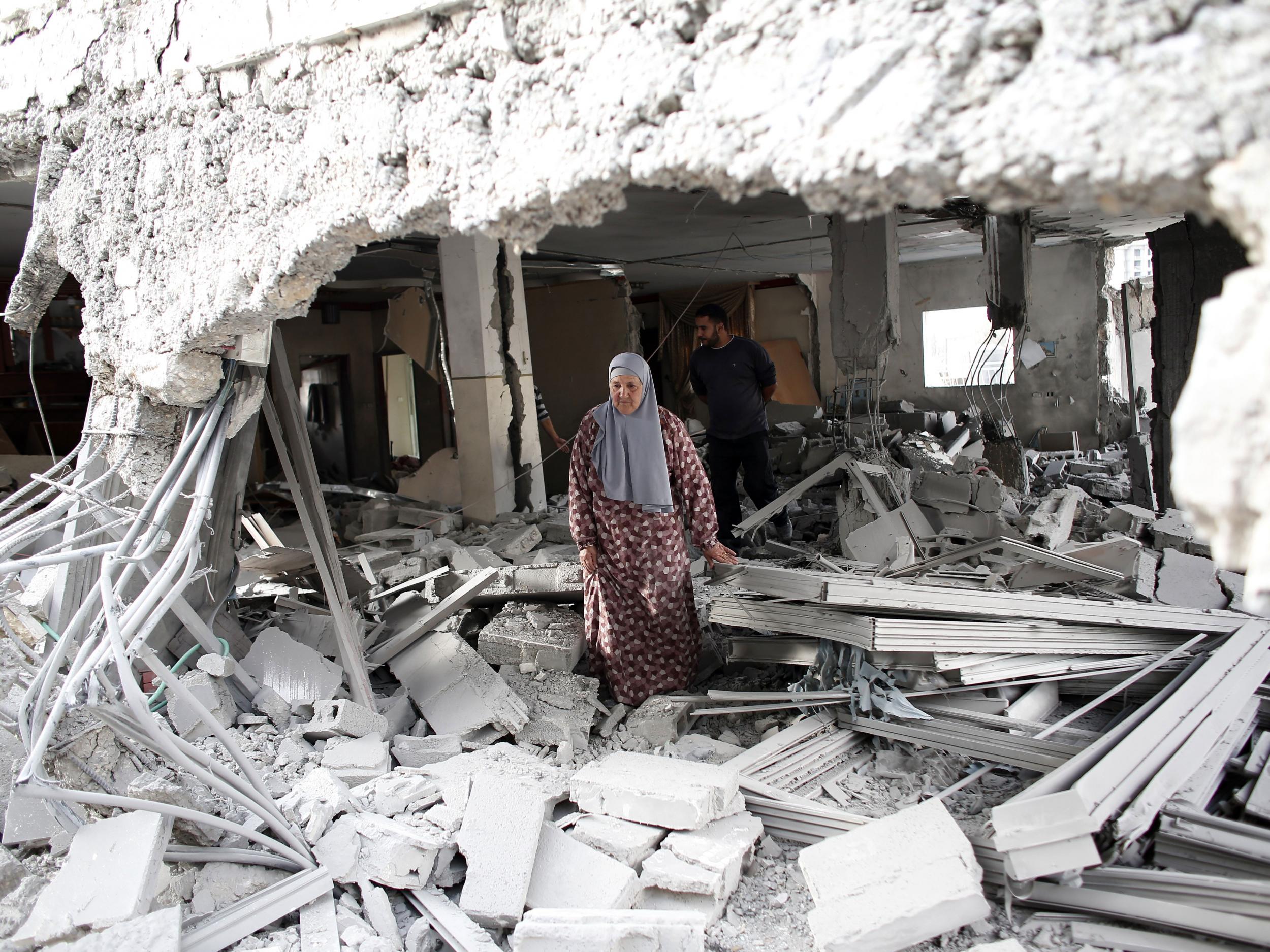 A Palestinian woman walks amid the rubble of a house after Israeli security forces demolished the homes of two Palestinians THOMAS COEX/AFP/Getty Images