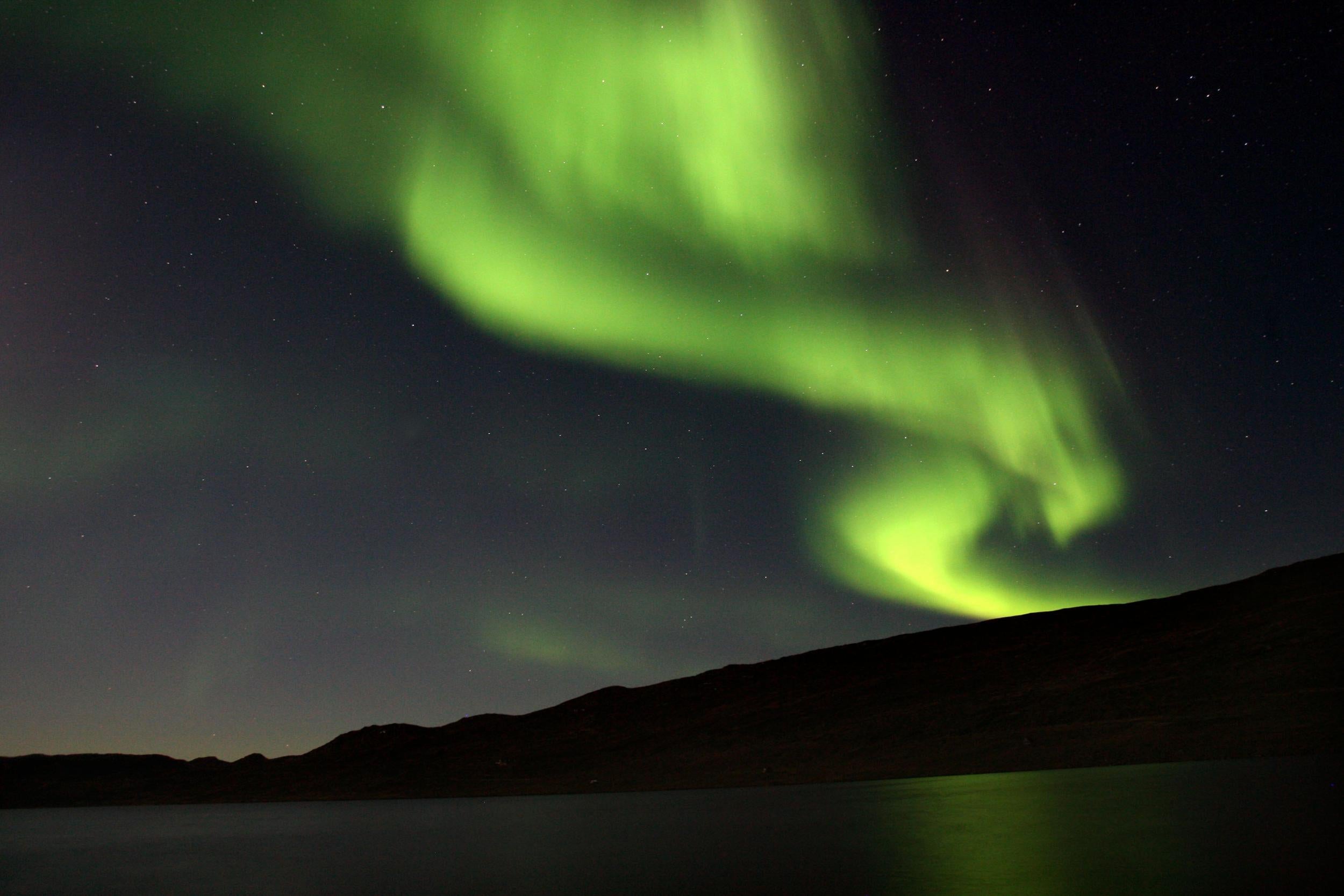 The Northern Lights, visible over Greenland