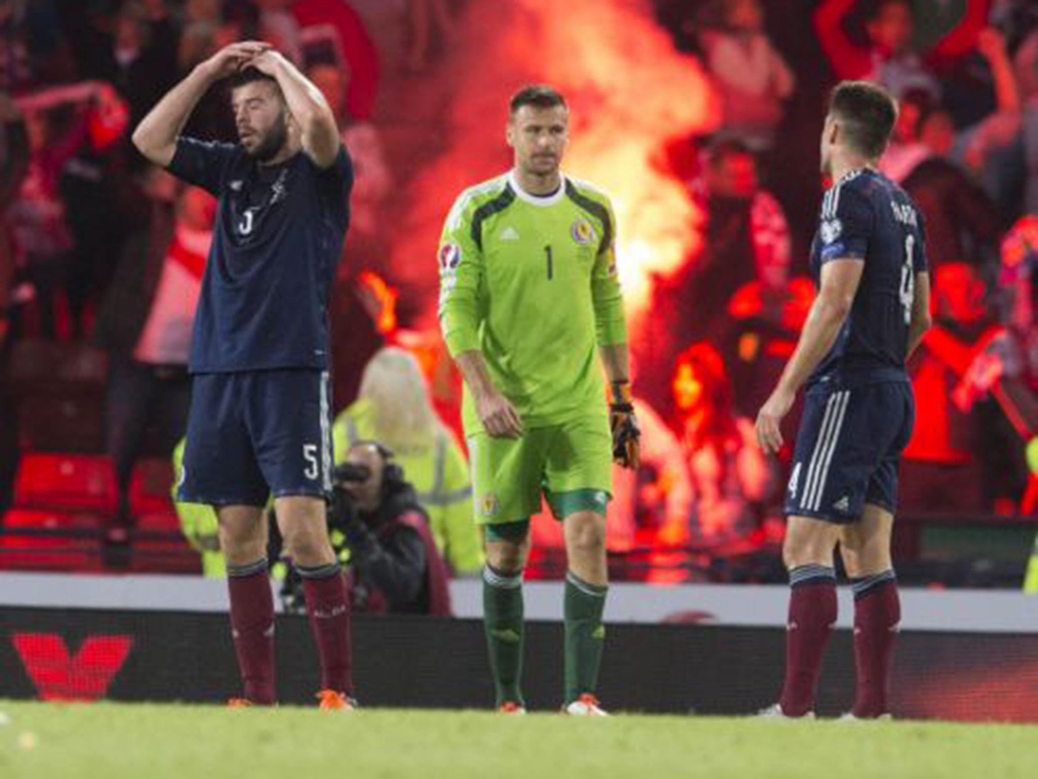 Grant Hanley, David Marshall and Russell Martin show their dejection at the final whistle