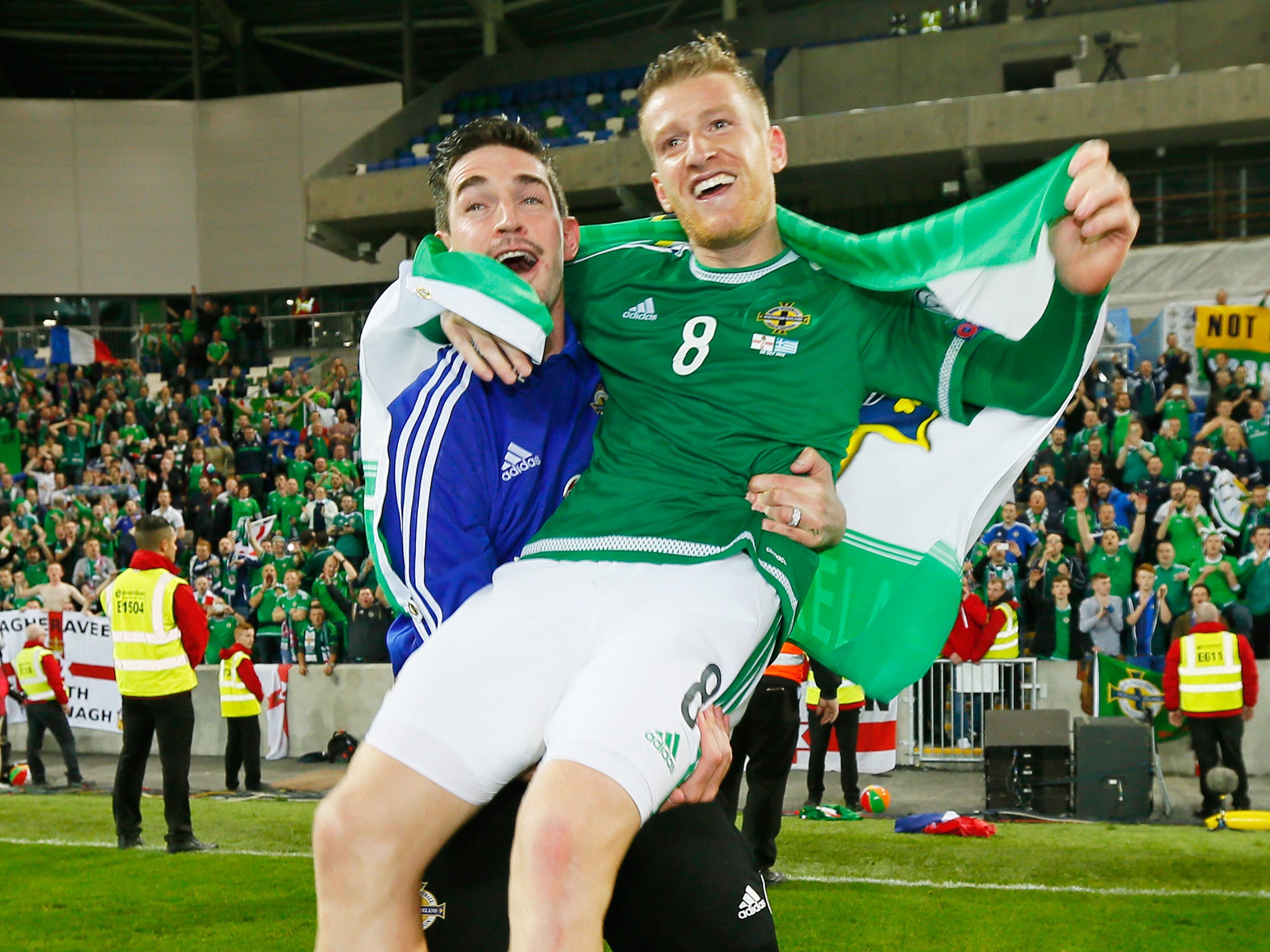 Steven Davis (right) and the suspended Kyle Lafferty celebrate after the victory over Greece on Thursday night