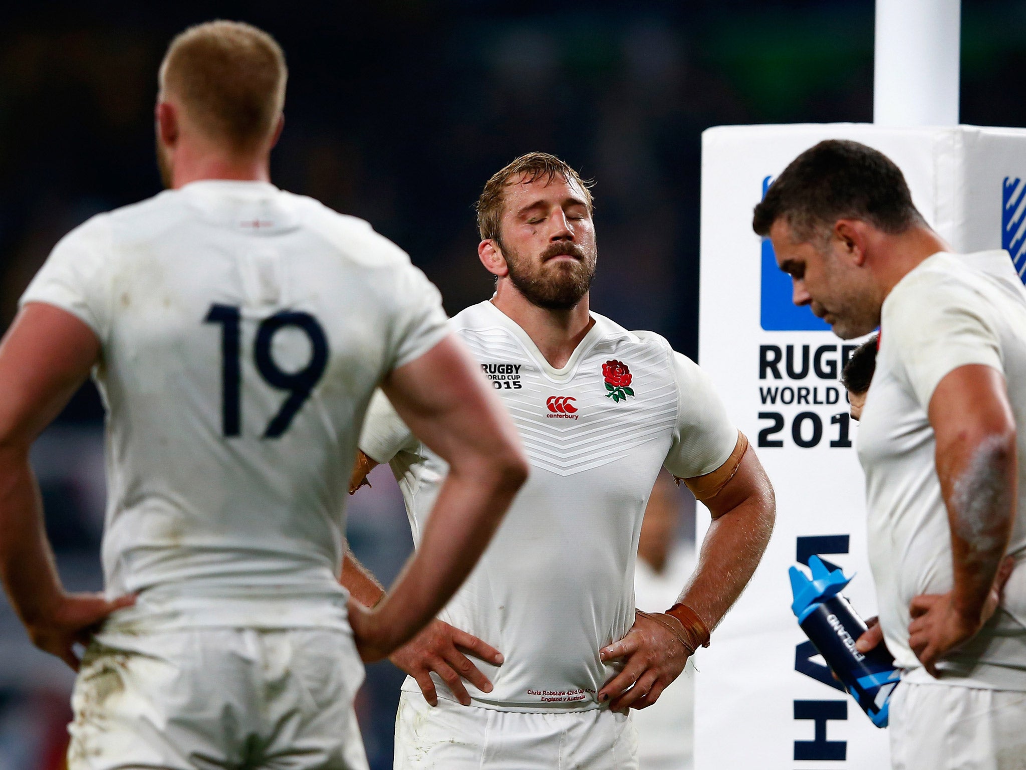 England captain Chris Robshaw, centre, looks on dejected after his side's exit from the Rugby World Cup