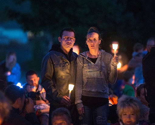 Residents of of a town near Roseburg commemorate those who died in a campus based shooting at Umpqua Community College at the beginning of the month