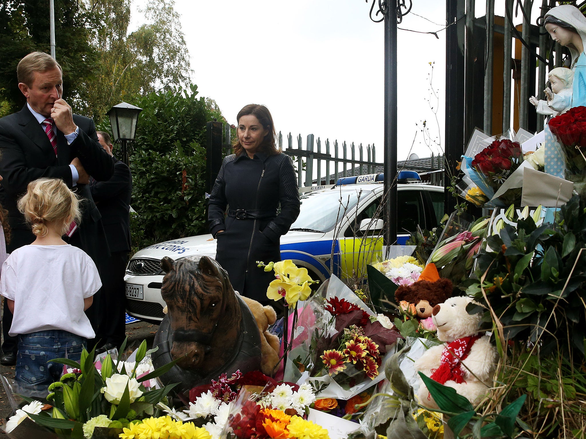 Taoiseach Enda Kenny at a halting site for travellers in Carrickmines, south Dublin, where ten people from two families, including a mother, father and a five-month-old baby, were killed in a fire yesterday