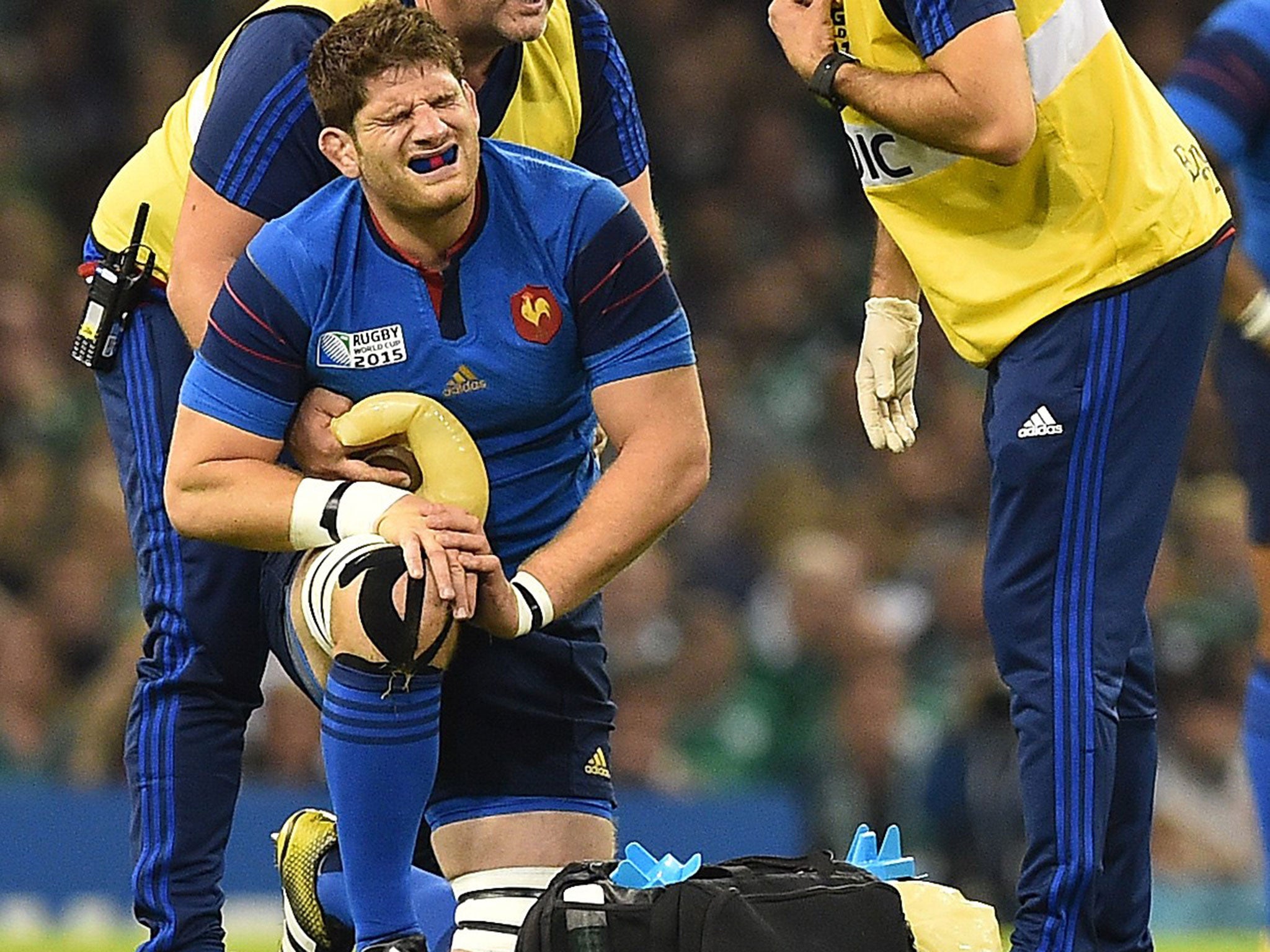 Pascal Pape receives treatment after being punched by Sean O'Brien