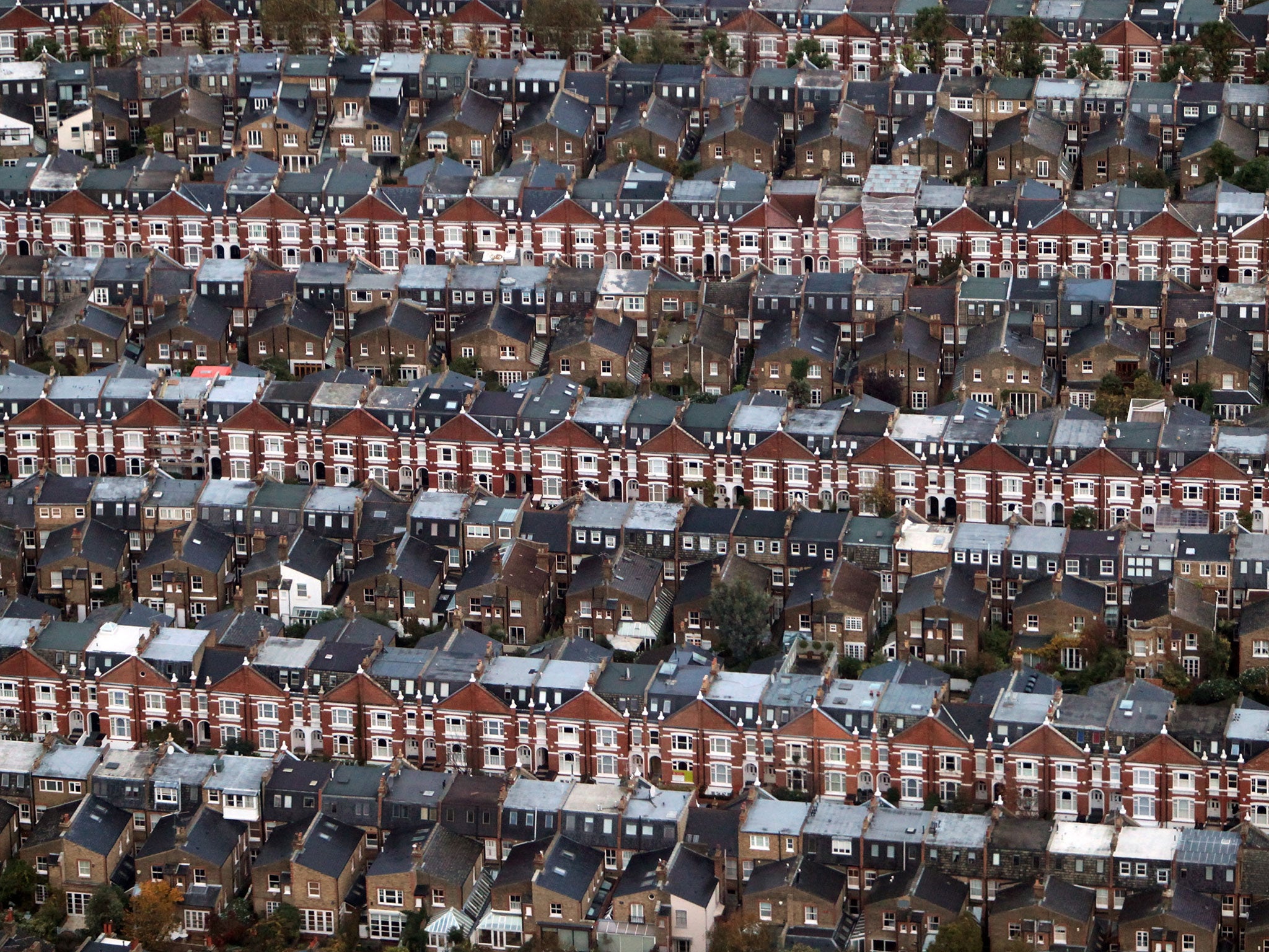 An aerial view of rows of terraced housing in London