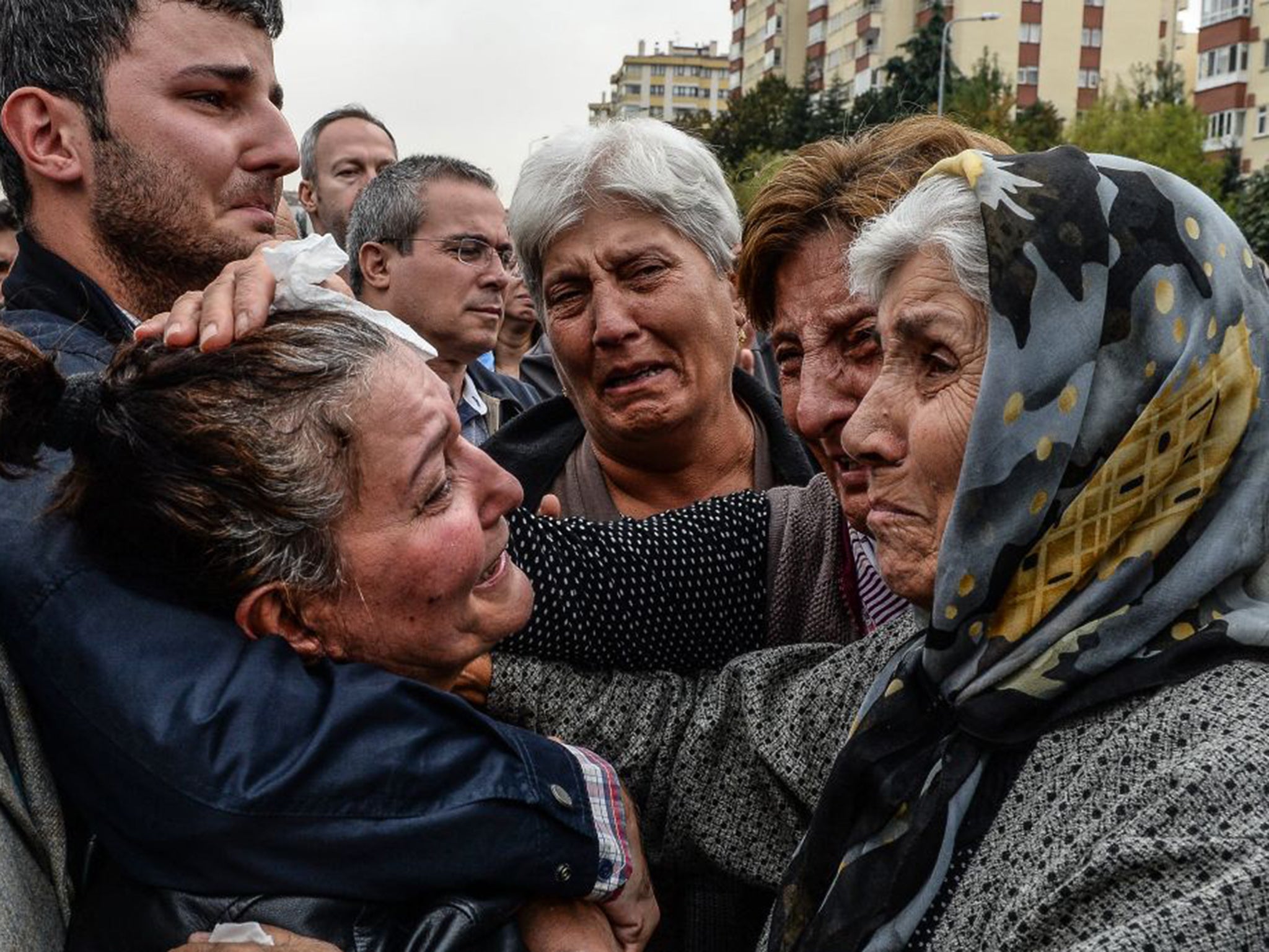 Friends and relatives of one of the victims of Saturday’s bombing attacks mourn at his funeral in Ankara. No group has yet claimed responsibility for the twin bombing that killed at least 97 people in the Turkish capital