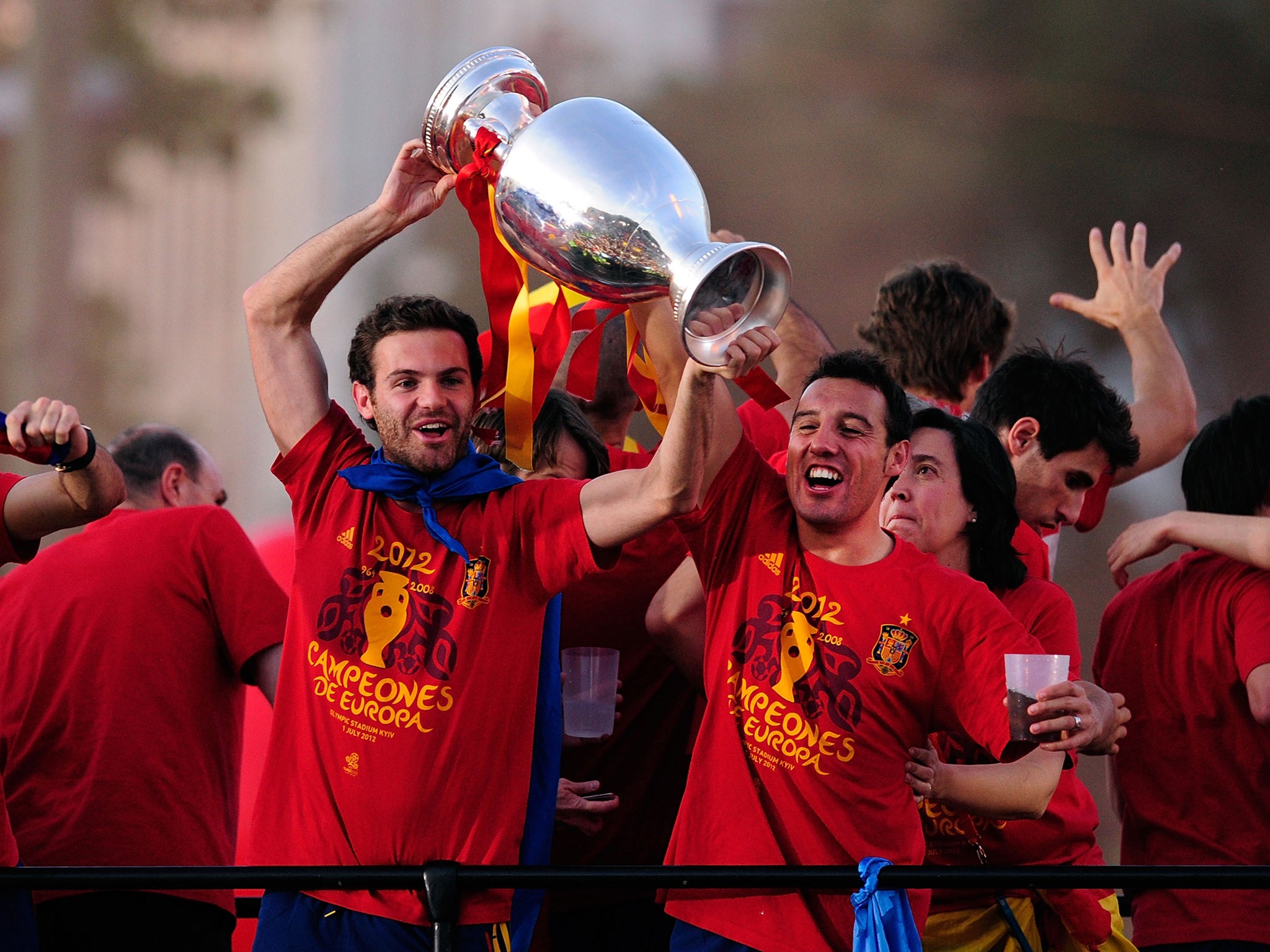 Spain's Juan Mata and Santi Cazorla lift the European Cup in 2012