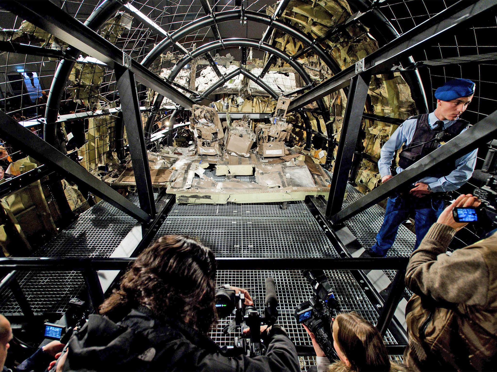 A view of the rebuilt cockpit section of Malaysia Airlines flight MH17 during a press conference to present the report findings of the Dutch Safety Board in Gilze Rijen