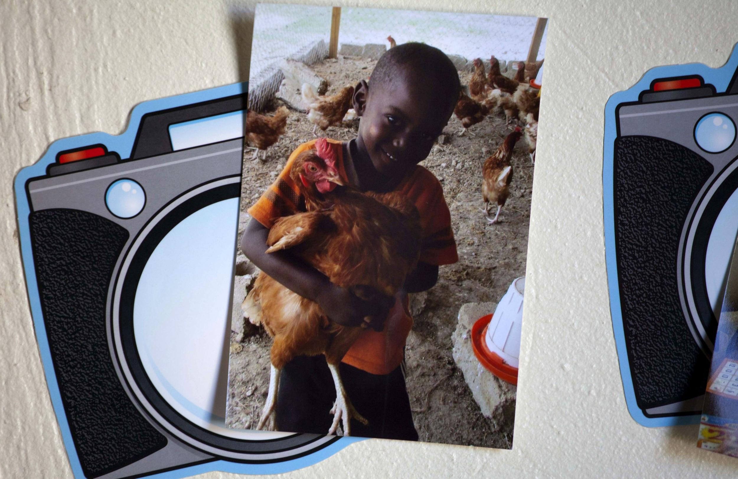 A photo of 4-year-old Jonathan Paul, nicknamed JoJo, is tacked to a wall at the Sonlight Children's Home in the Port-au-Prince