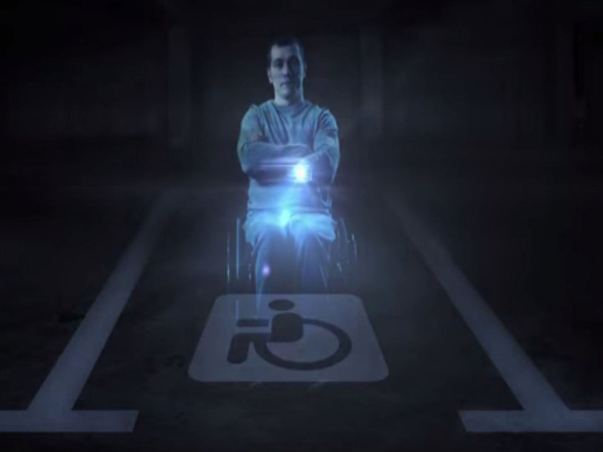 The hologram appears over disabled parking spaces when able-bodied drivers try and park there