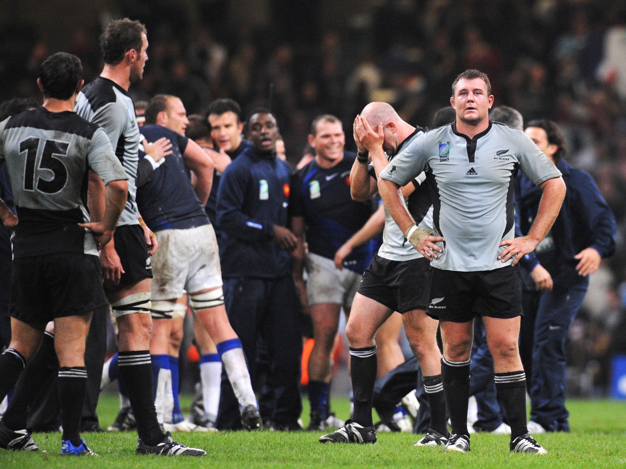 New Zealand players react to defeat by France in the 2007 Rugby World Cup