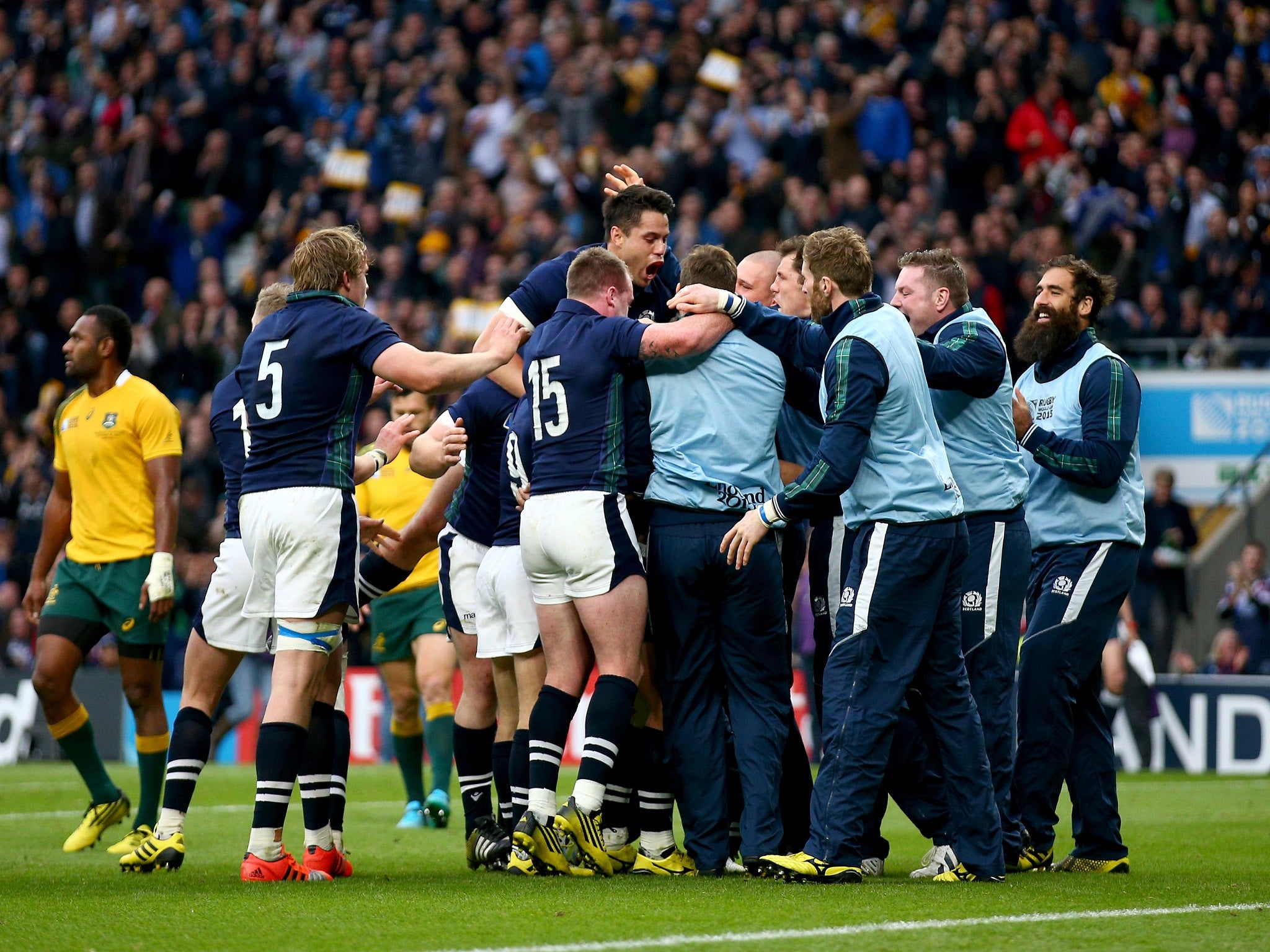 Scotland celebrate after Peter Horne scores a try against Australia