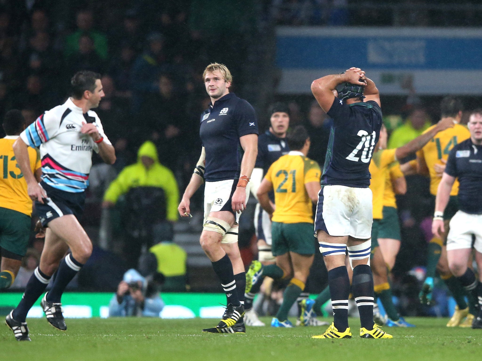 Craig Joubert runs off the Twickenham pitch at full-time of the Australia v Scotland match