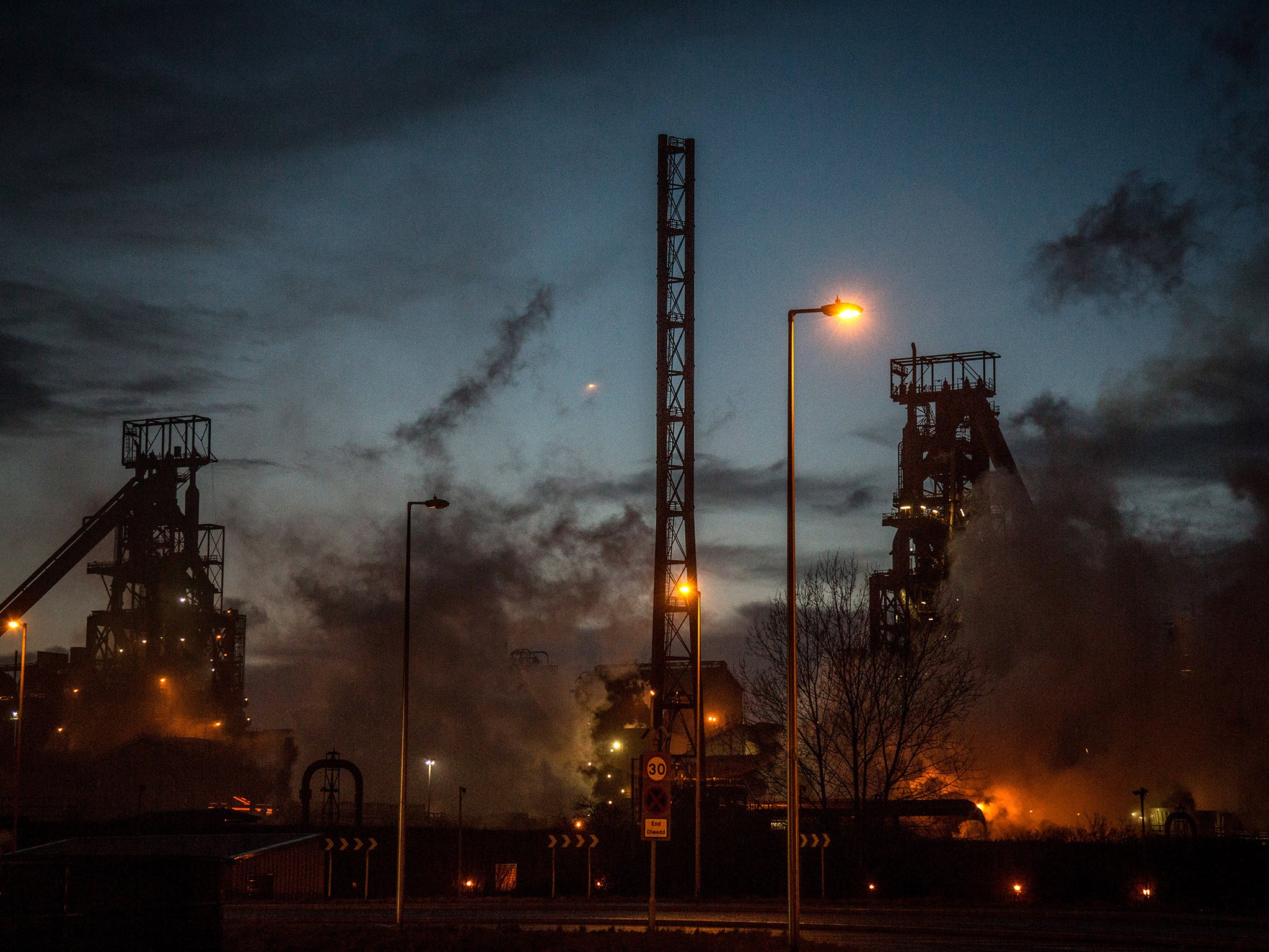 Steam rises from the blast furnaces at the Tata owned steel works in Port Talbot, Wales