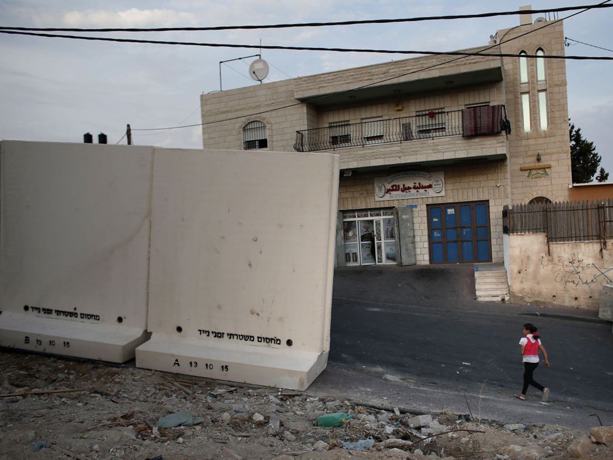 Israeli officials have started to build a wall to separate the Palestinian area of Jabal Mukaber from the Jewish settlement of Armon Hanatziv