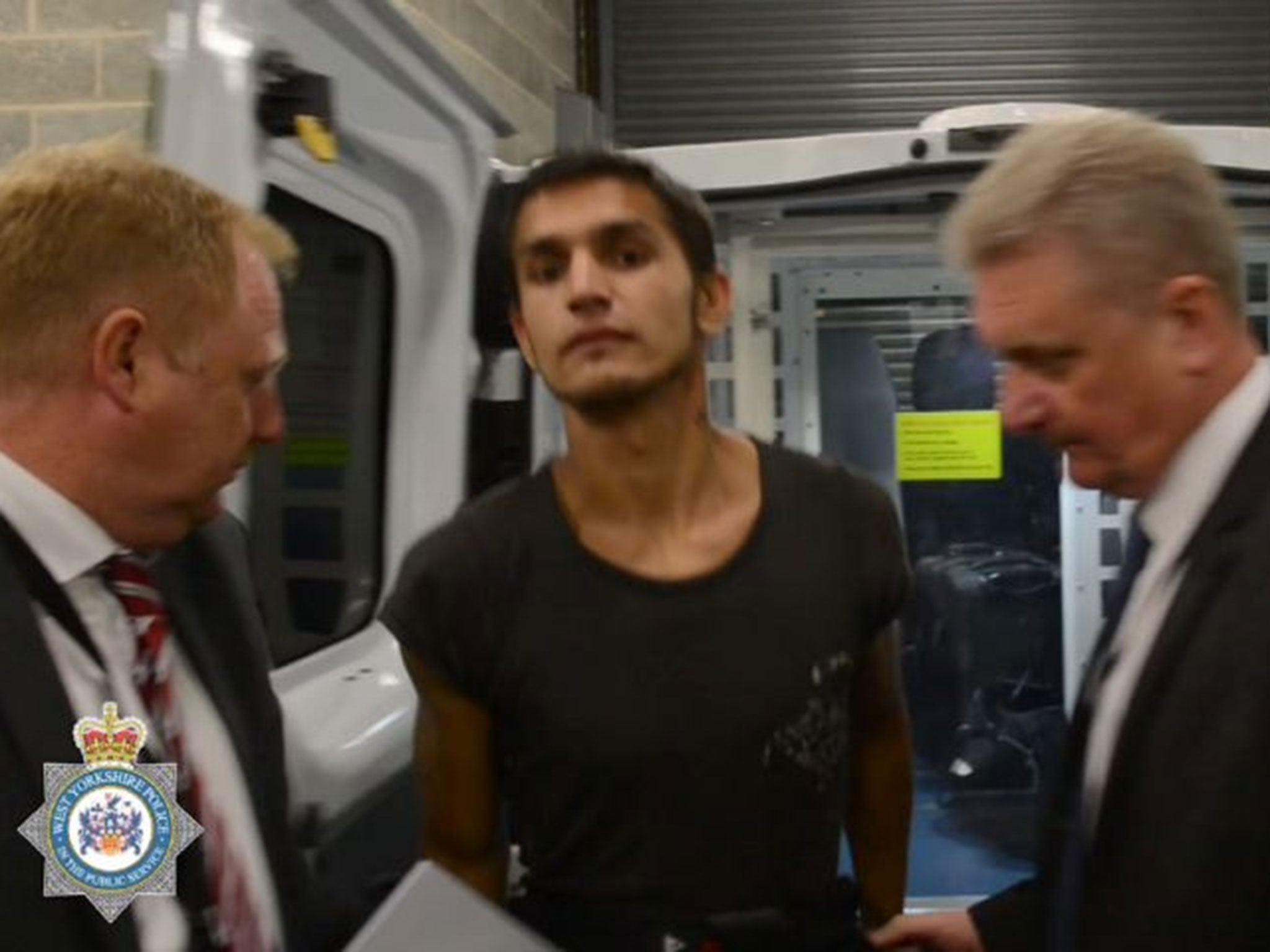 West Yorkshire Police handout image of Zdenko Turtak being led from a police van at Leeds' Elland Police Station after his arrest on 10 July