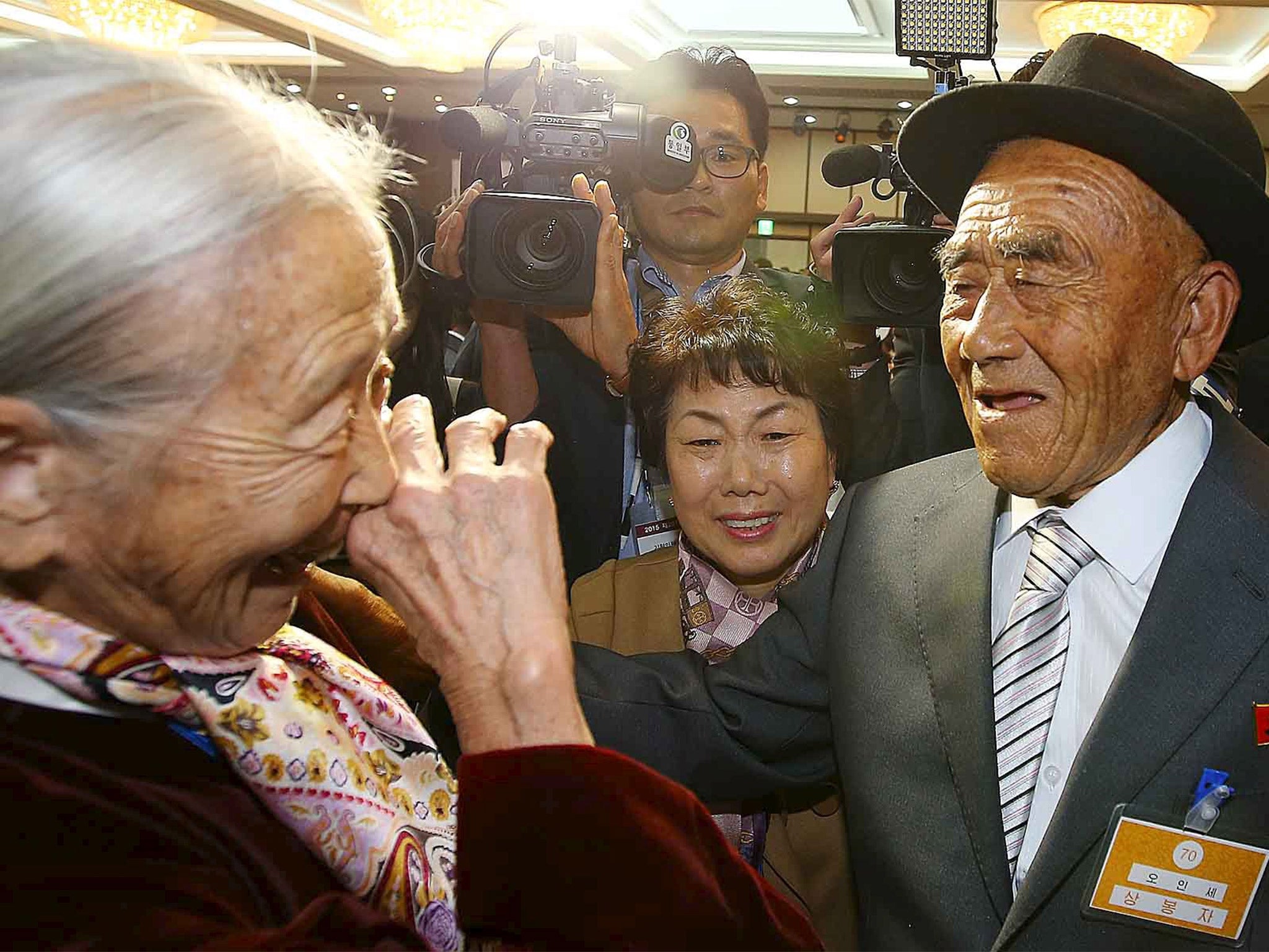 South Korean Lee Soon-kyu (left), 85, meets with her North Korean husband Oh Se In, 83