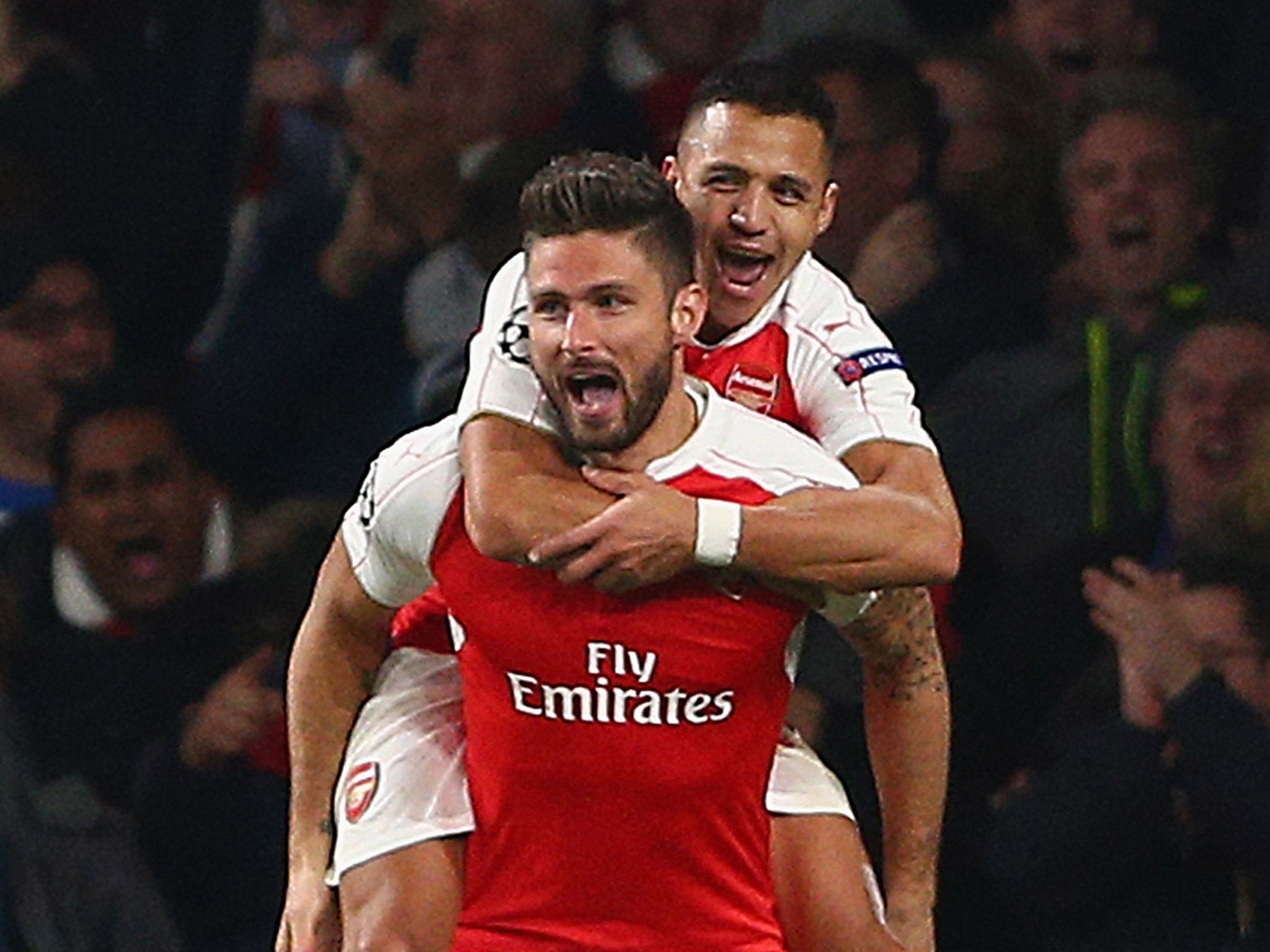 Alexis Sanchez celebrates with Olivier Giroud