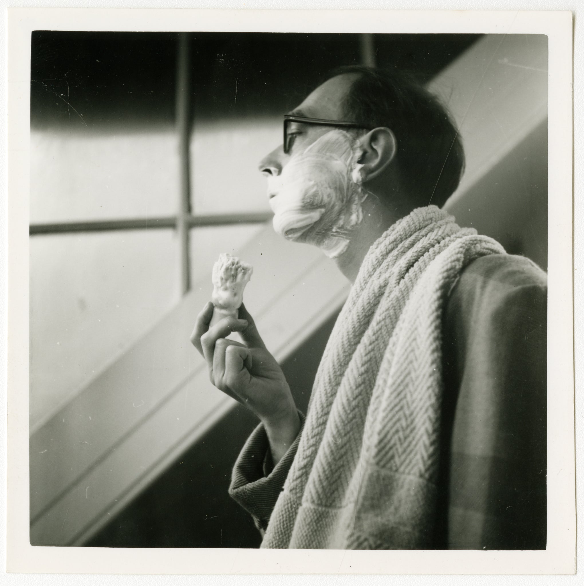 A selfie taken by Philip Larkin of him shaving in 1957