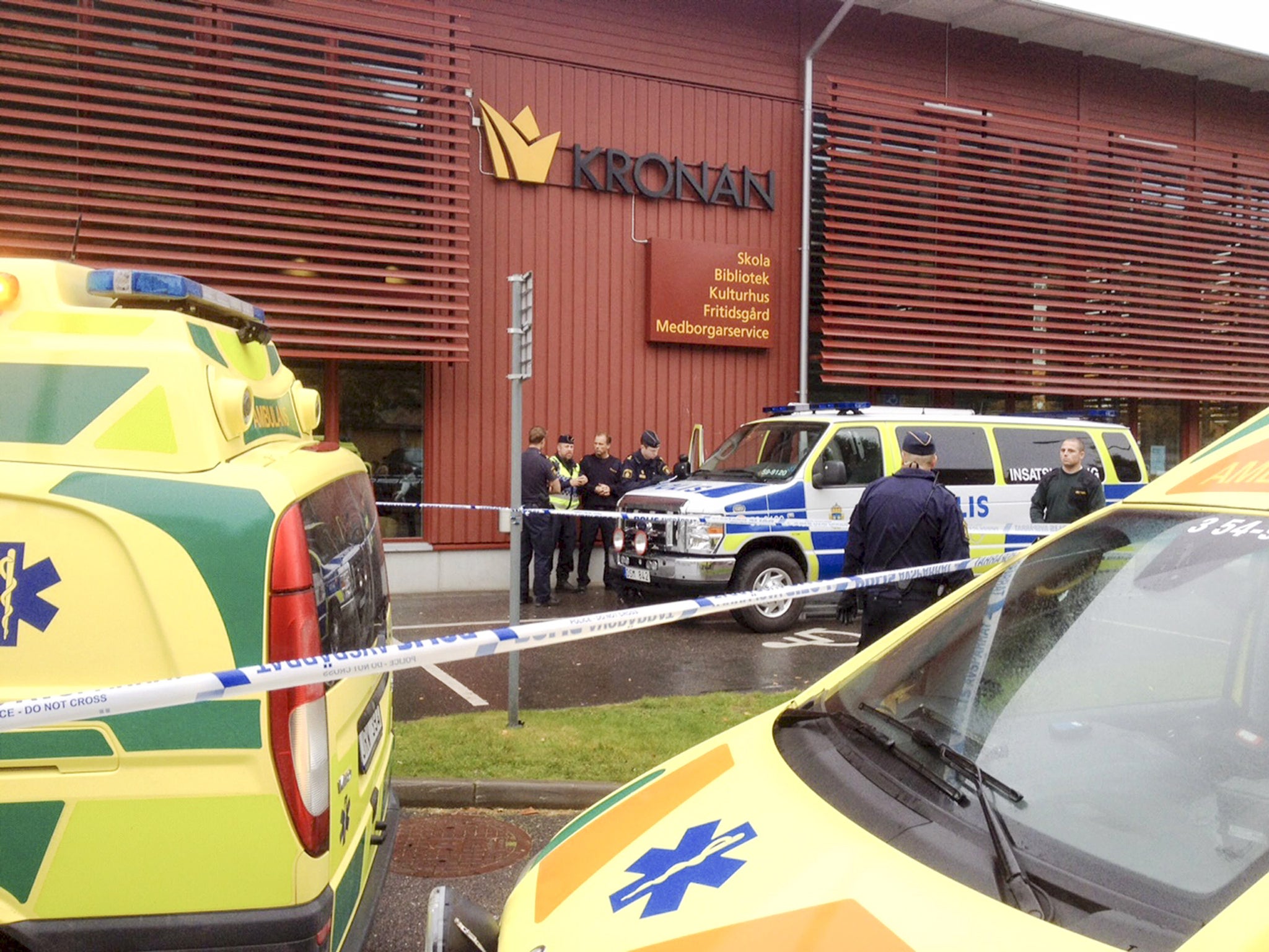 Police cordon off an area after a masked man attacked people with a sword at a school in Trollhattan