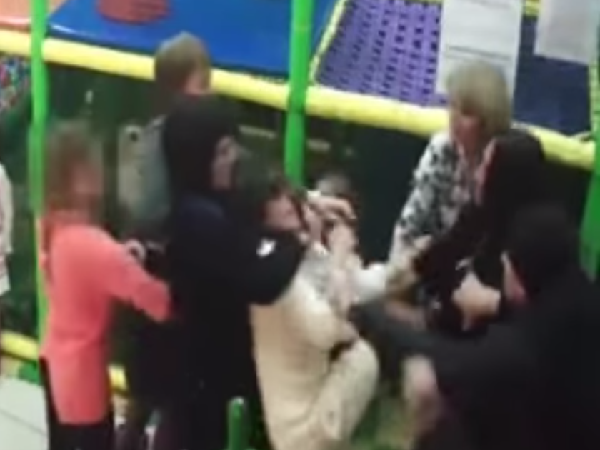 The shocking footage shows the women pushing, punching, kicking and shoving each other