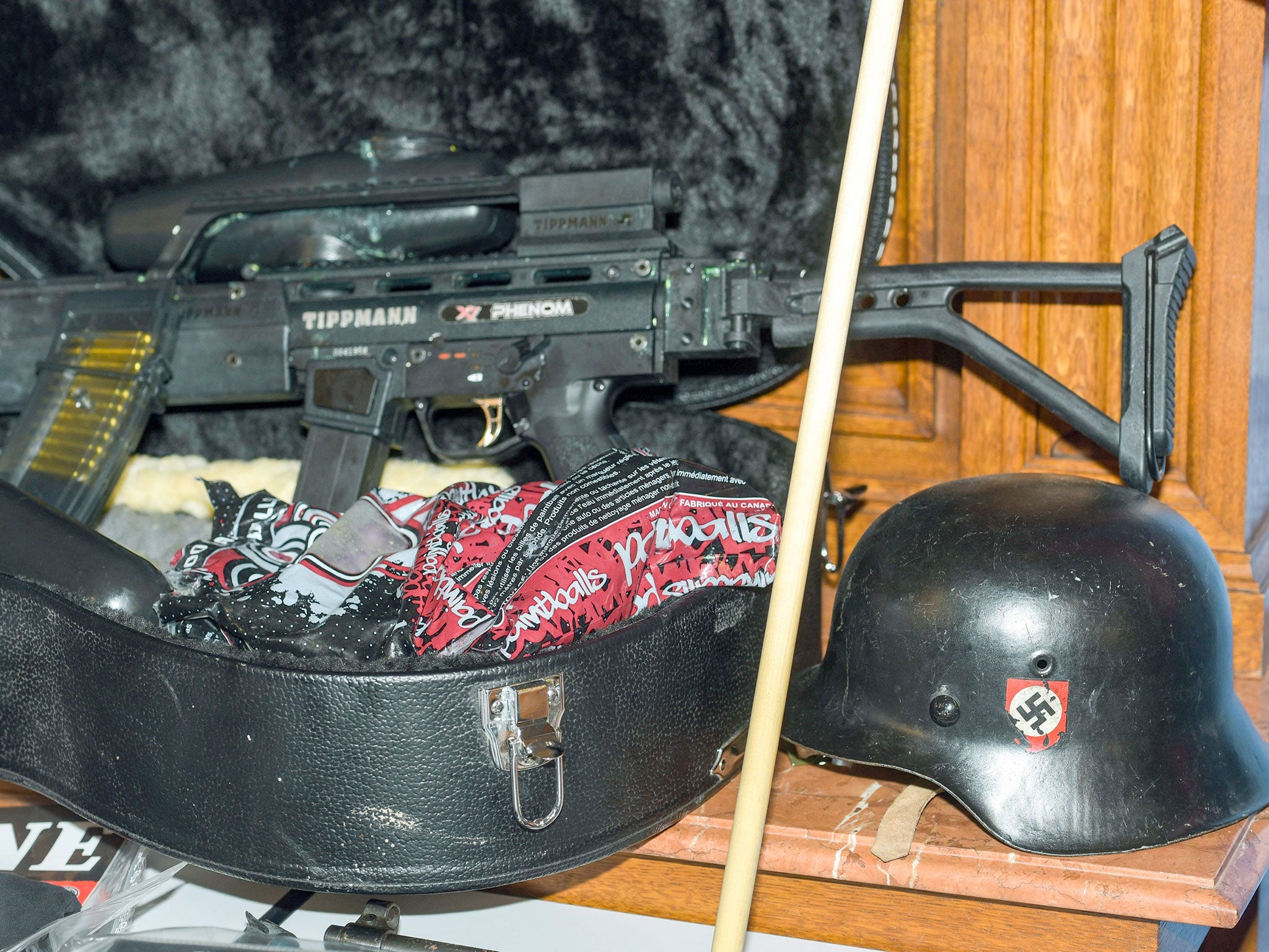 A gun and a Nazi helmet were among the items found