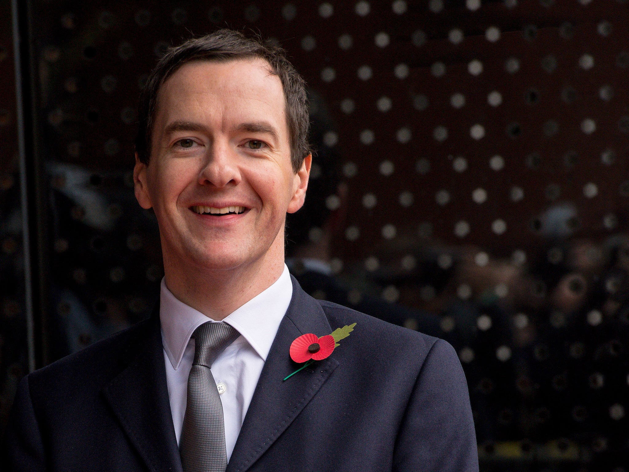 Britain's Chancellor of the Exchequer George Osborne waits for Chinese President Xi Jinping to arrive to tour the National Graphene Institute at Manchester University