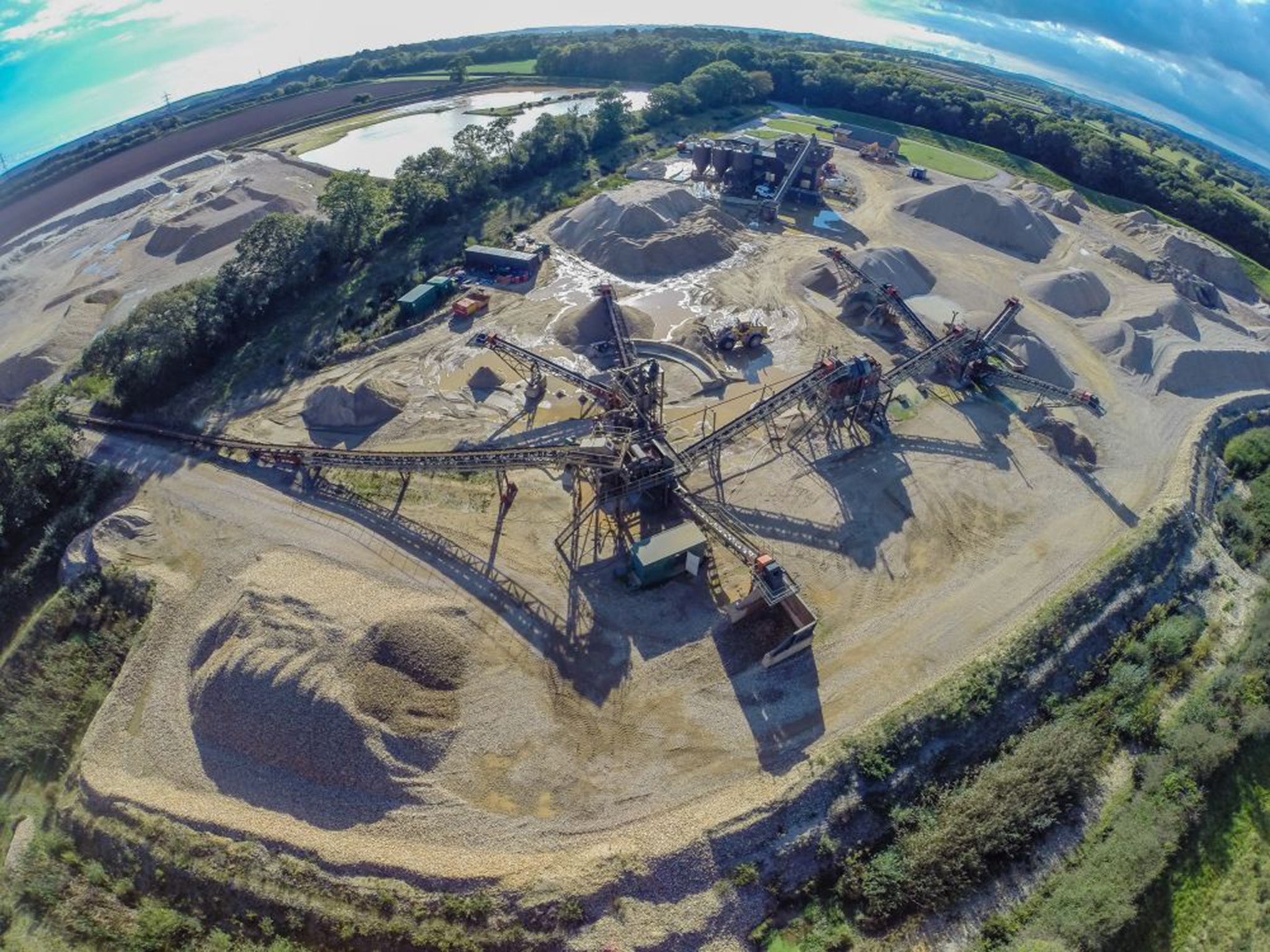 An aerial view of an existing quarry near to Moreton, the proposed site of three new ones