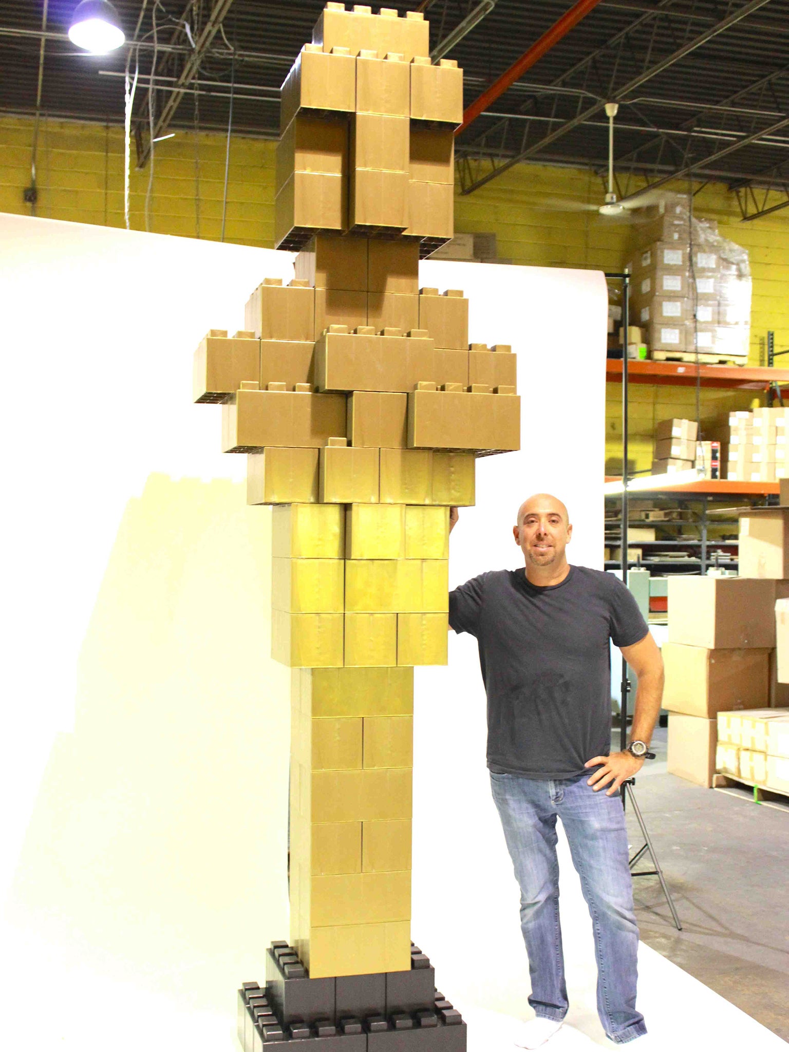 Arnon Rosan with an Oscars statue made from EverBlock building blocks