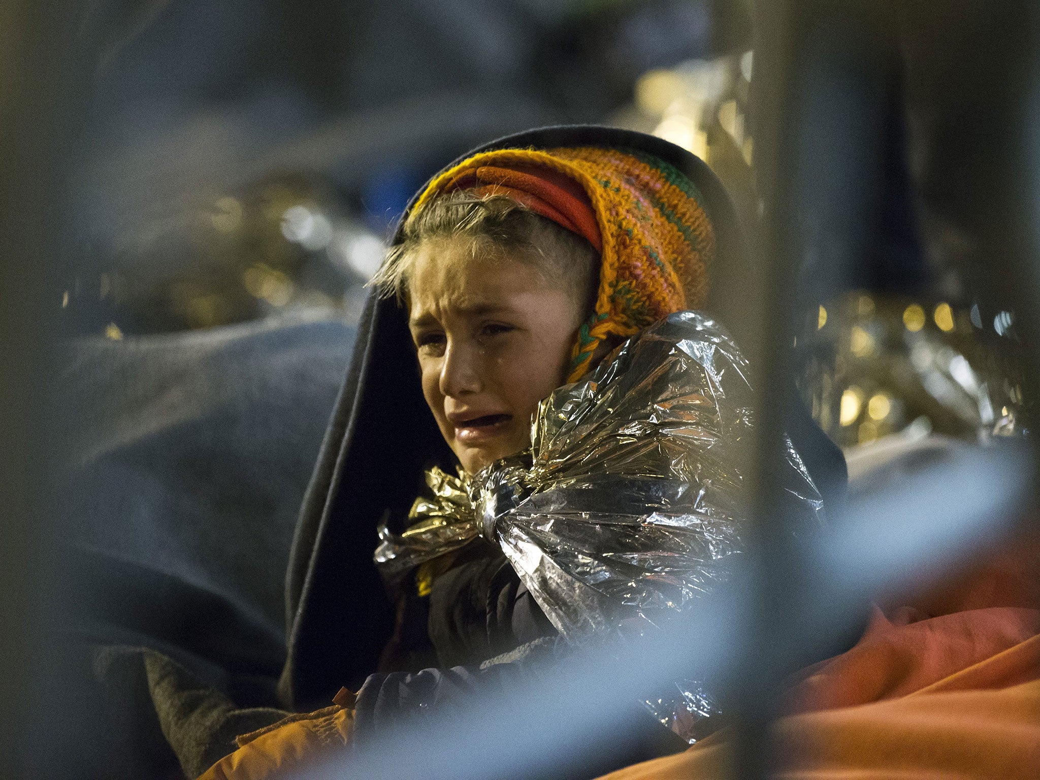 A refugee child cries at the camp at the Slovenian-Austrian border near Spielfeld, Austria, 24 October 2015