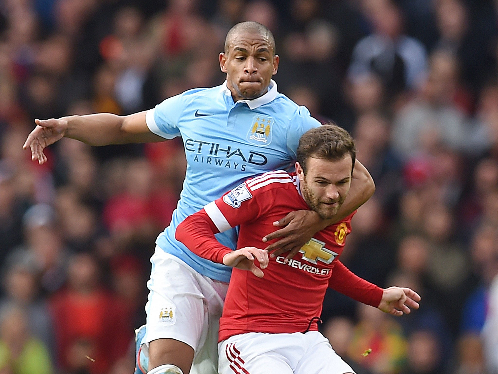 &#13;
Fernando and Juan Mata battle for the ball&#13;