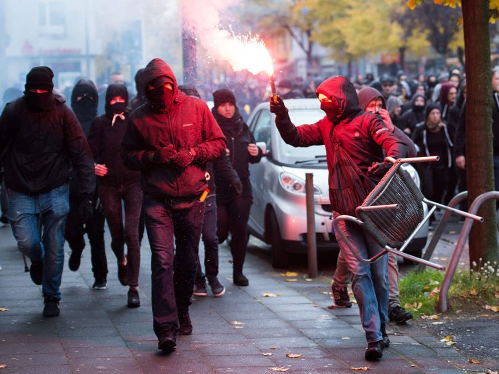 Members of German far-right groups attend a demonstration in Cologne