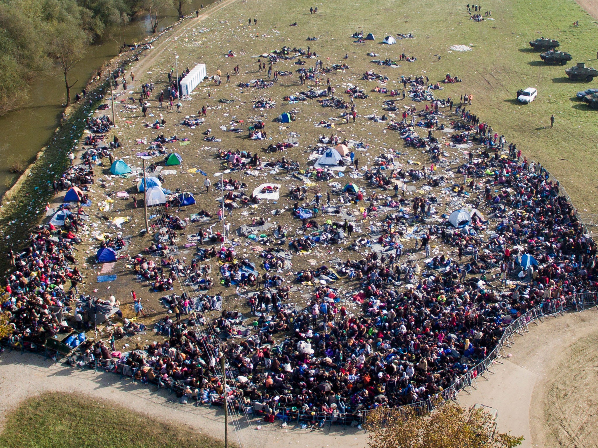 Refugees are blocked by Slovenian police in Rogonce after arriving from Croatia