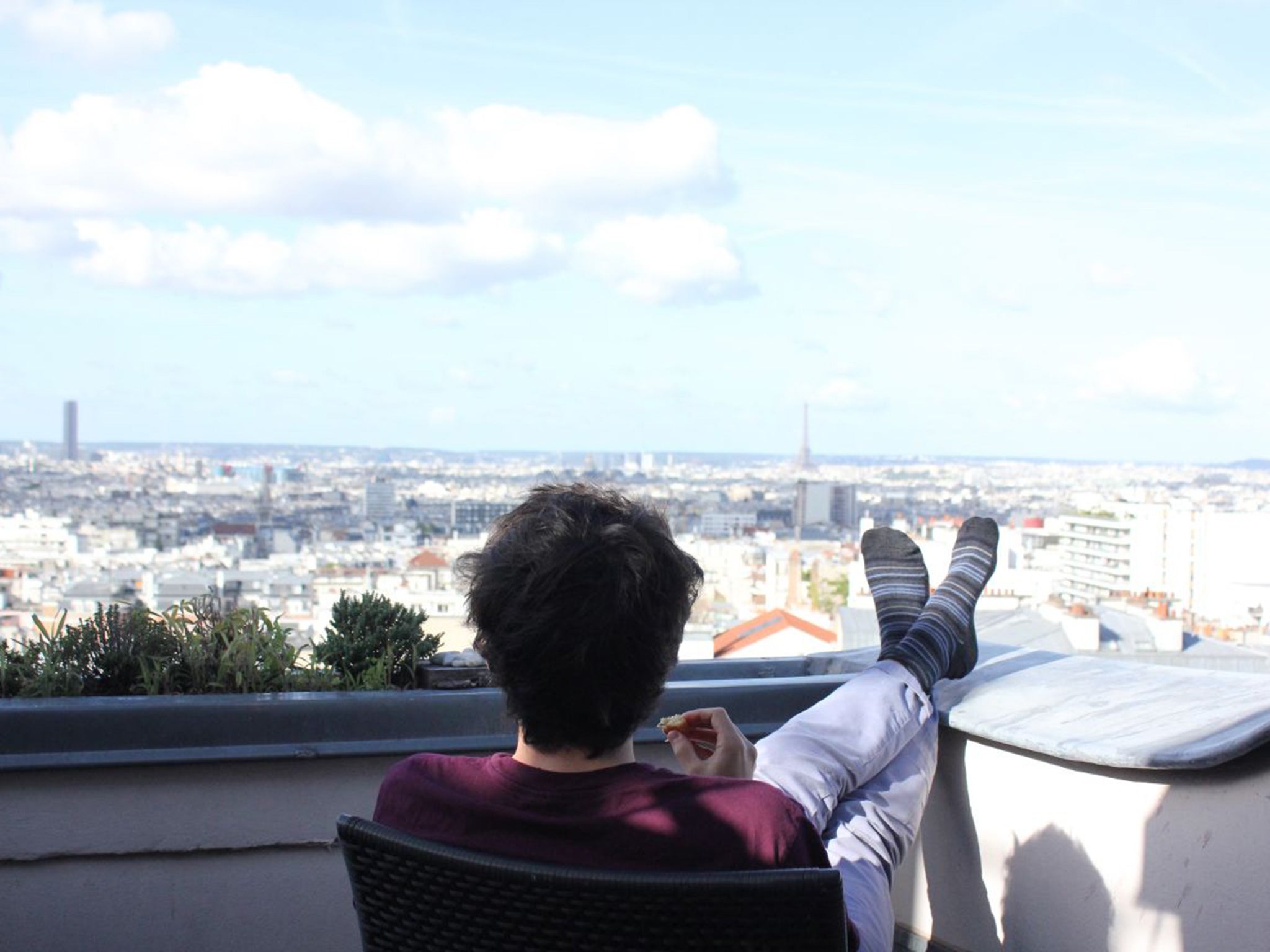 Greg Dickinson enjoys the Paris skyline (main) from his apartment