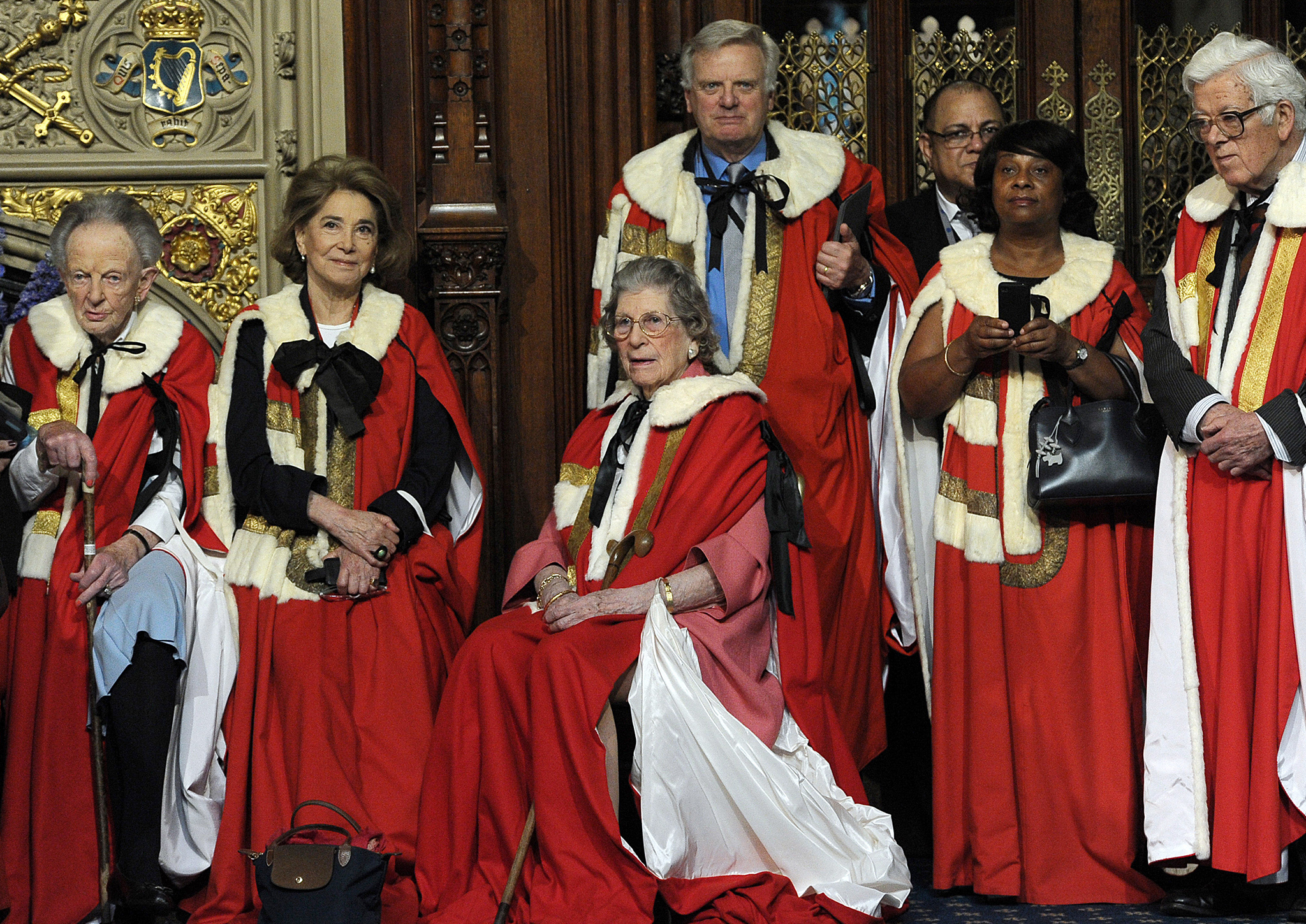 Peers look on as Yeomen of the Guard prepare to conduct the ceremonial search ahead of the State Opening of Parliament at the Palace of Westminster on June 4, 2014 in London